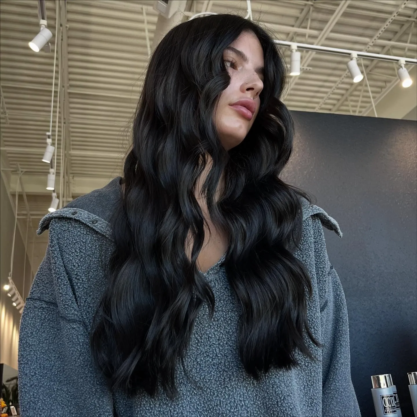 Long jet black wavy hair with high shine