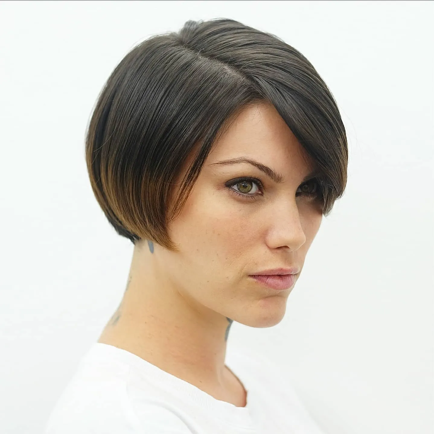 Side-swept tapered ear-length bob with a softly stacked back