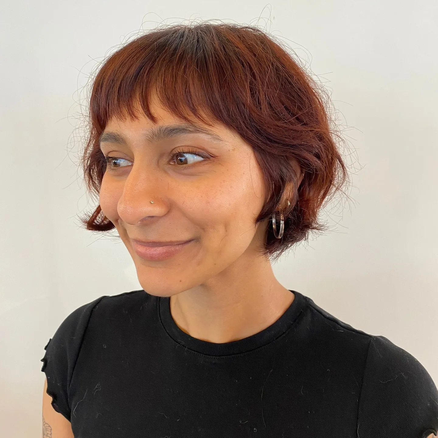 Soft wavy ear-length bob with fringe and tucked sides