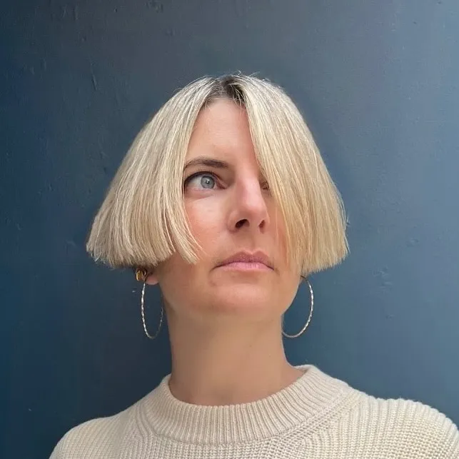 Blunt ear-length bob with a centre part and full shape