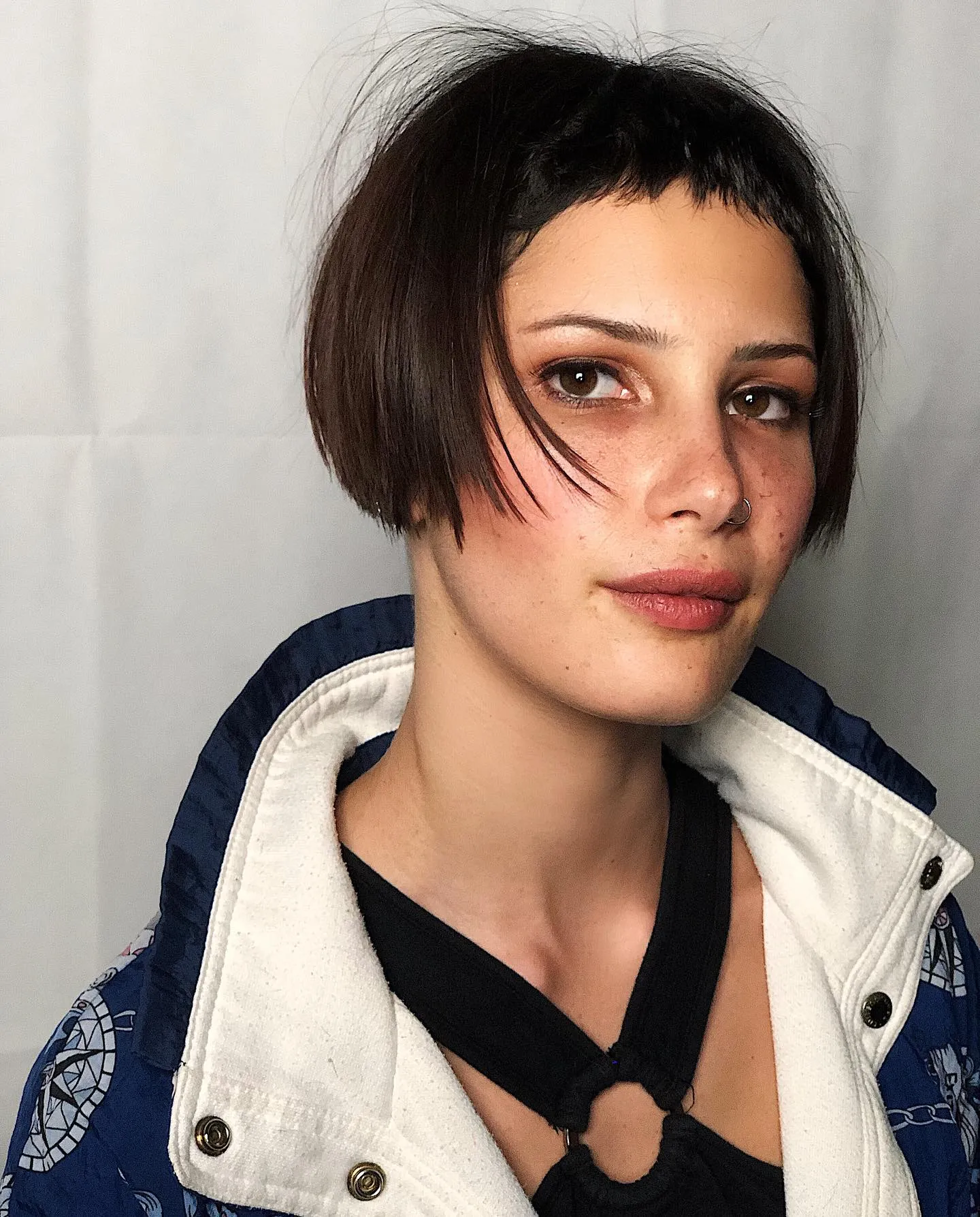 Choppy dark micro bob with short uneven fringe