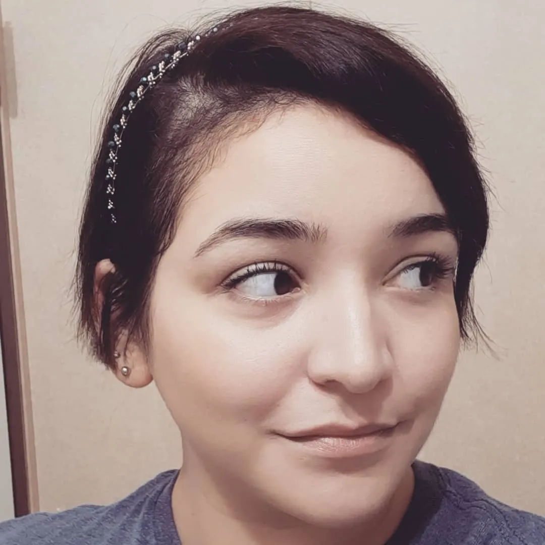 Short pixie bob with side-swept fringe and slim headband