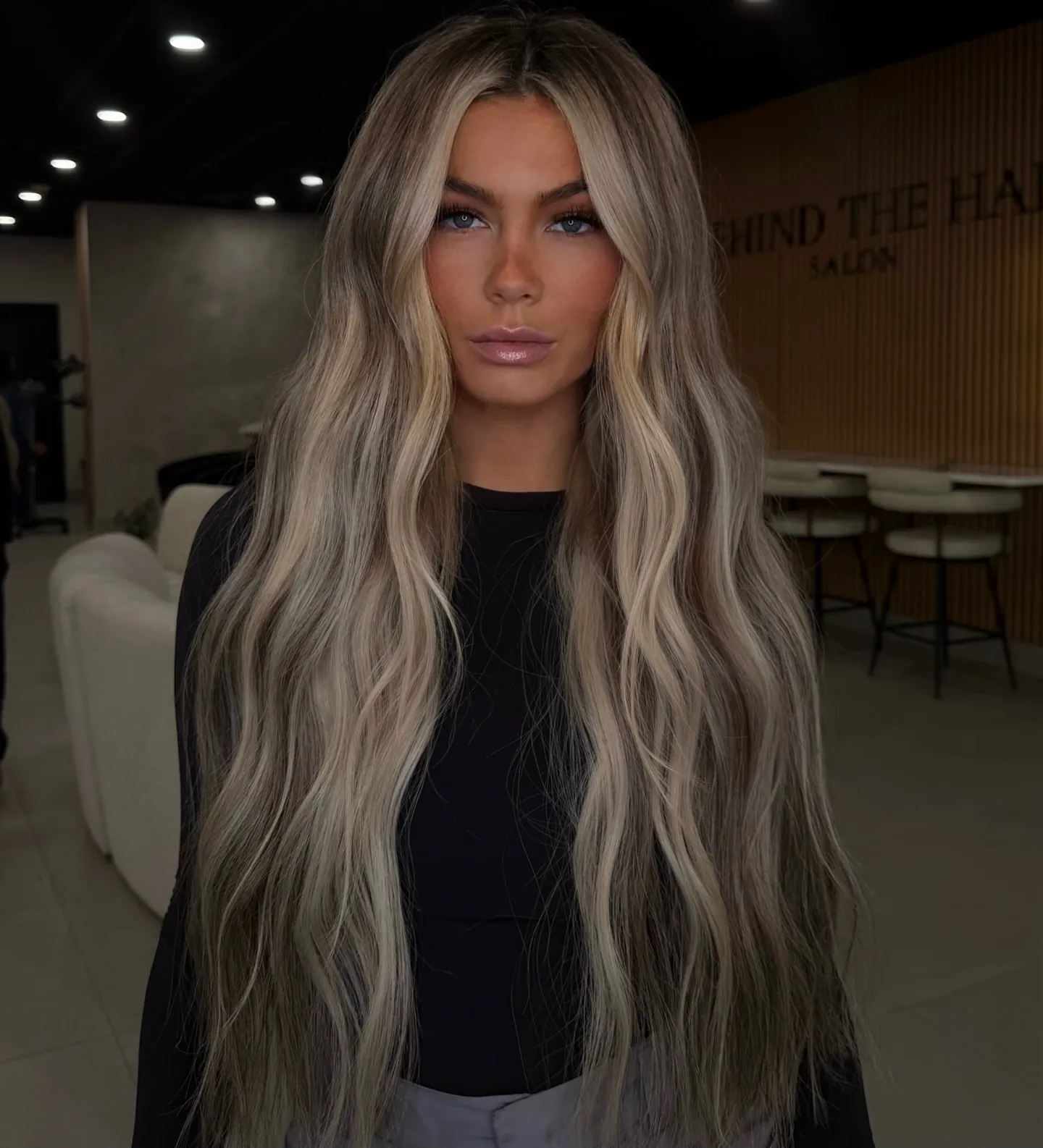 Long blonde waves with a darker shadow root