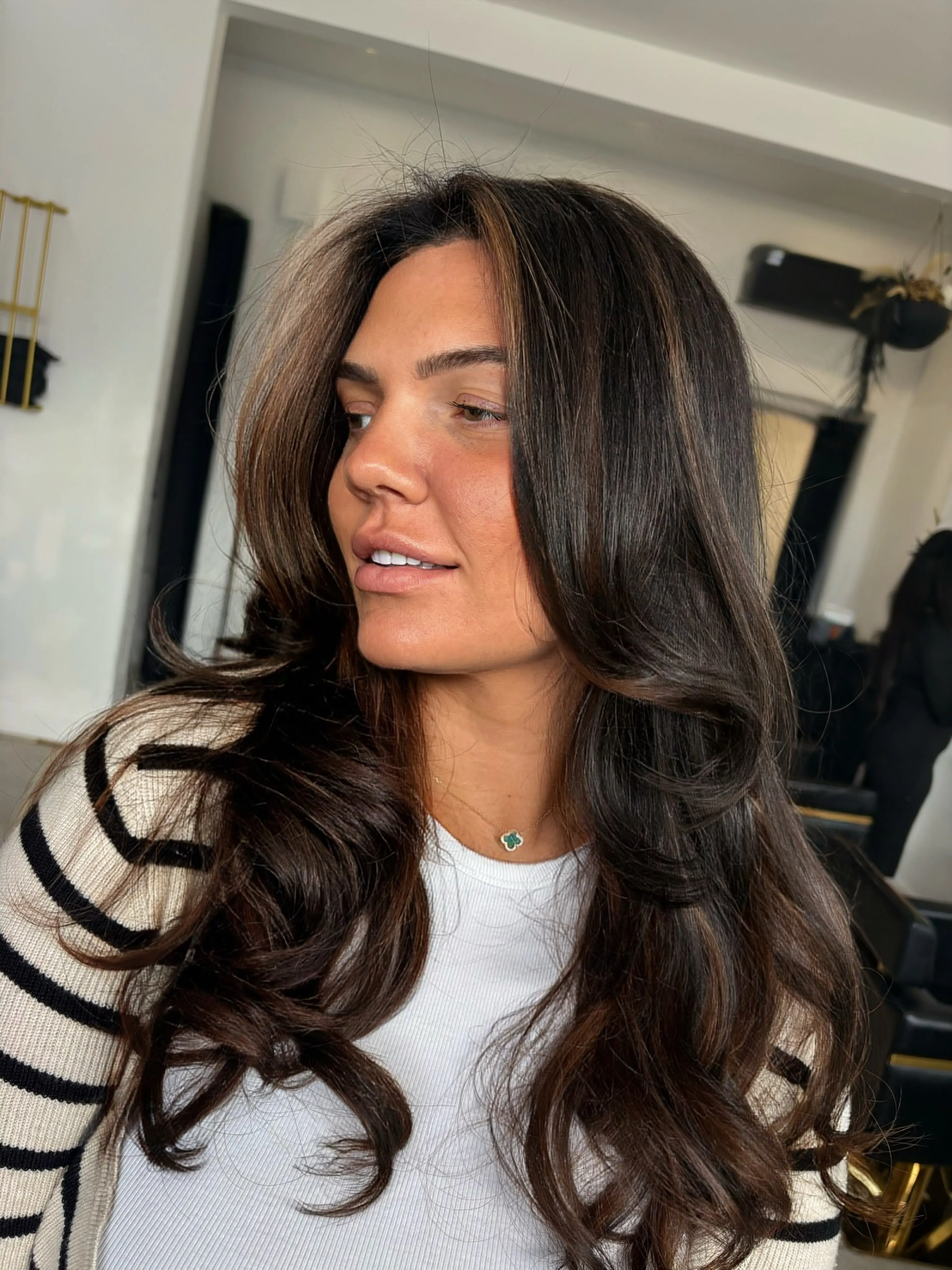 Long dark brunette hair with soft face-framing layers