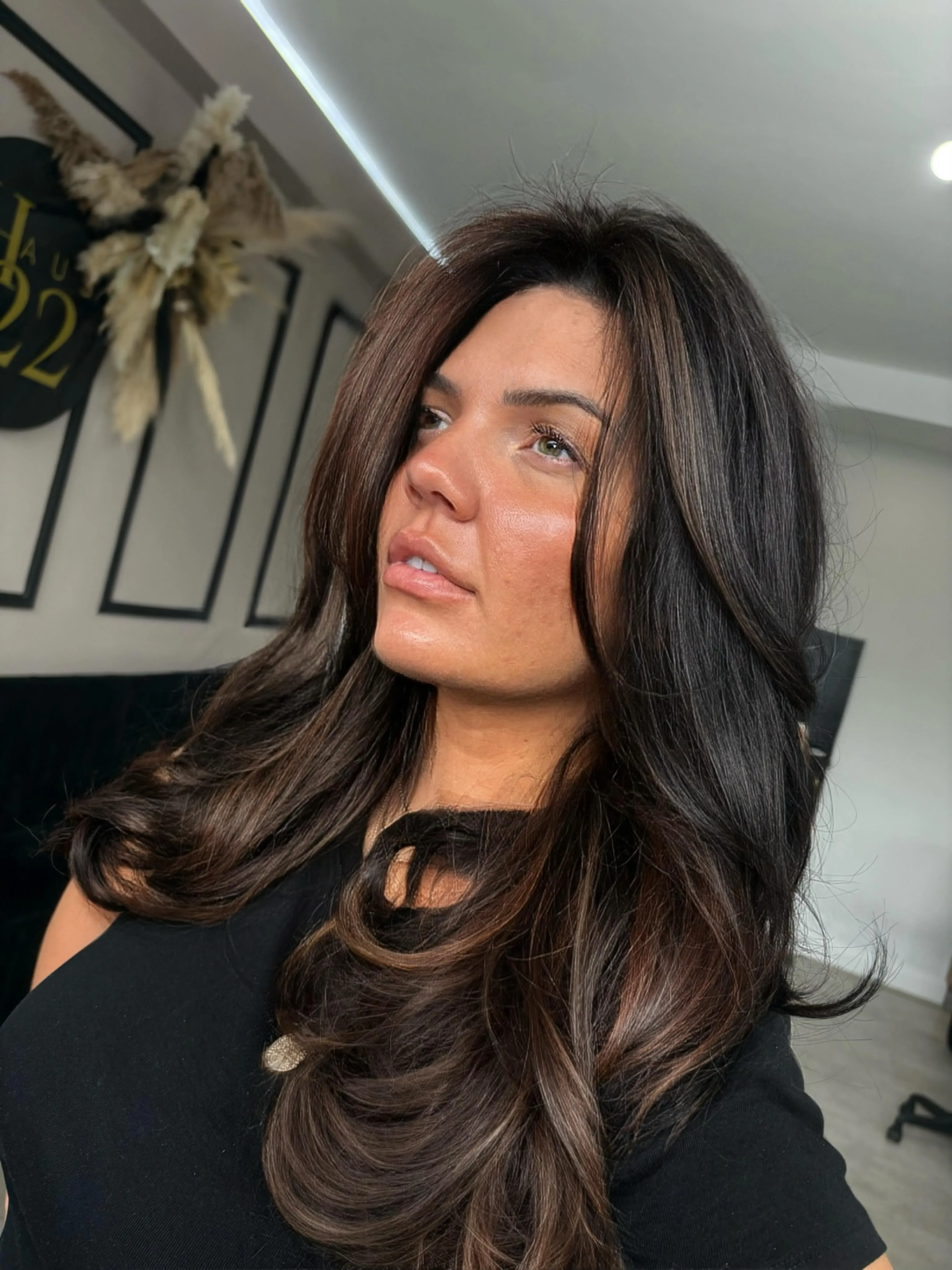 Deep brunette layered hair with soft face framing