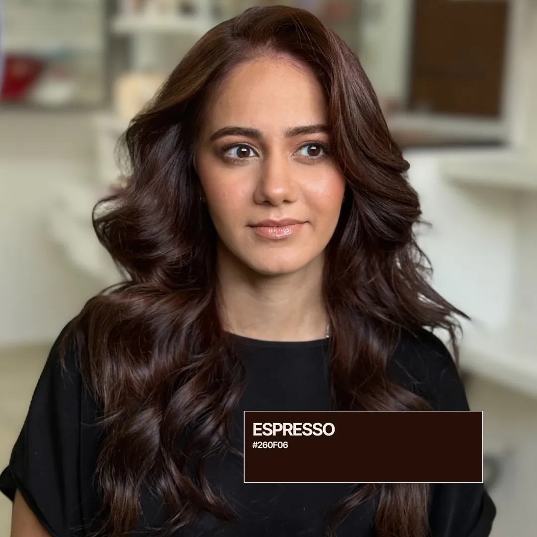 Rich deep brunette hair styled in polished waves