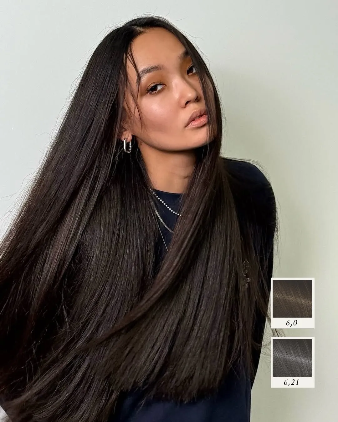 Very long sleek dark brunette hair with subtle tonal depth