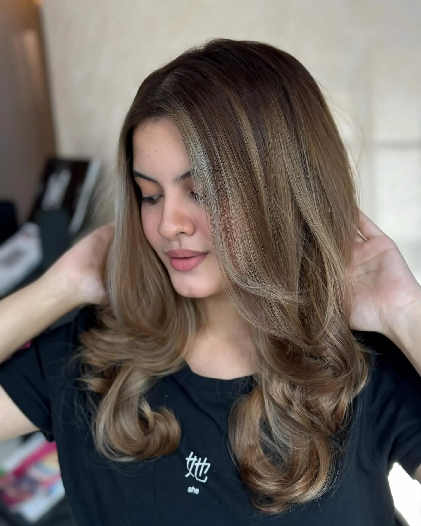 Smoky beige brunette hair with curled layered ends