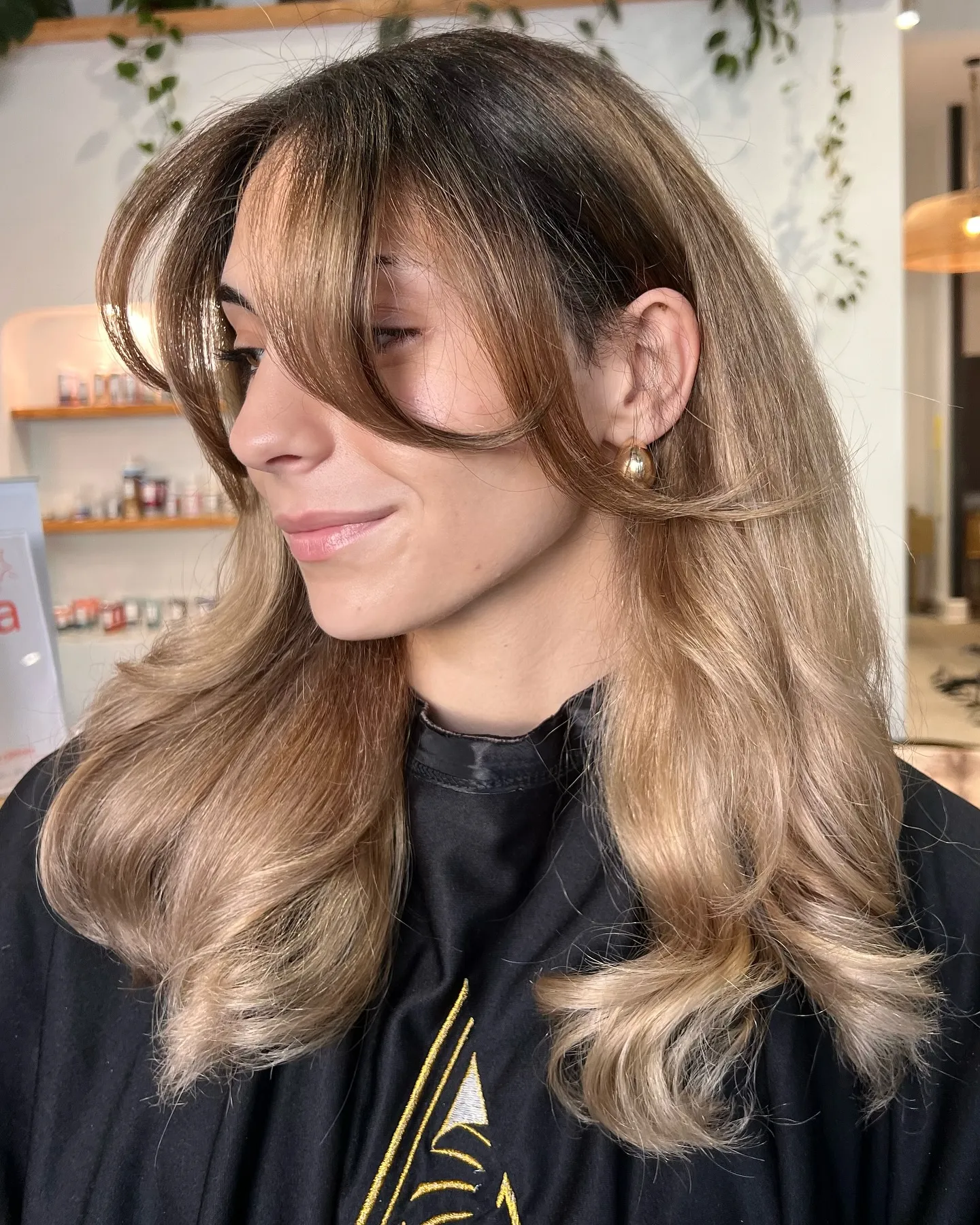 Dimensional blonde with curtain bangs and long layers