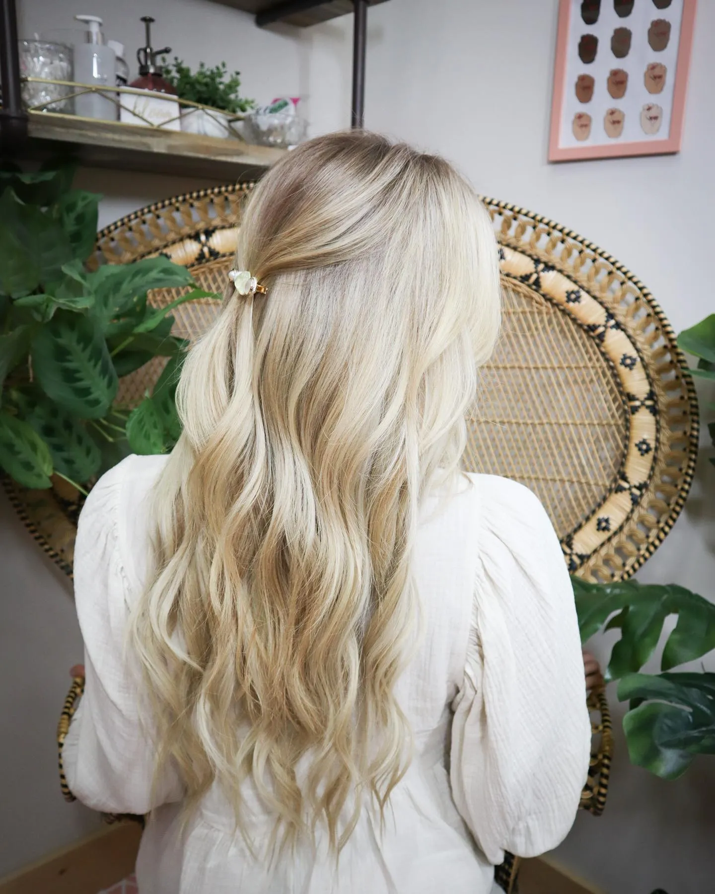 Long soft blonde waves with half-up clip
