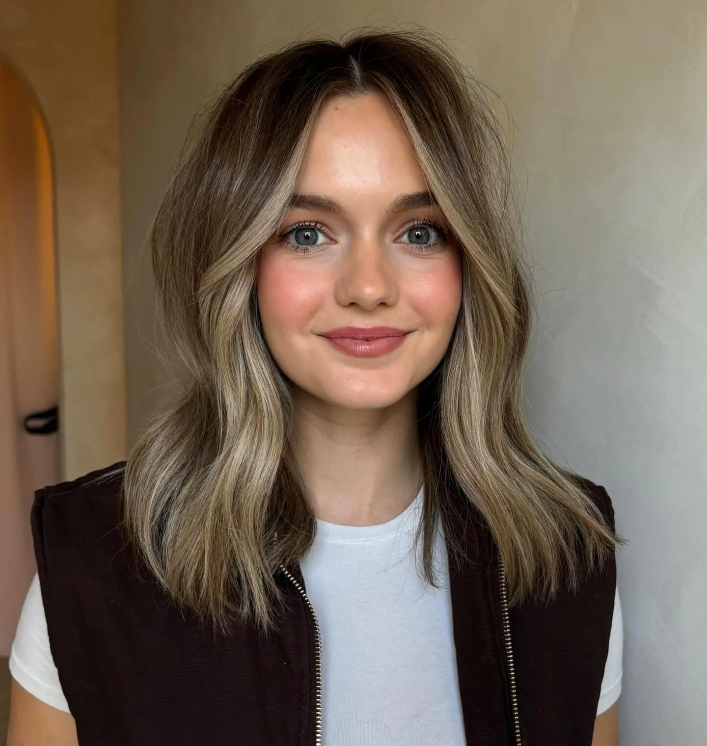 Soft beige blonde medium waves with darker roots
