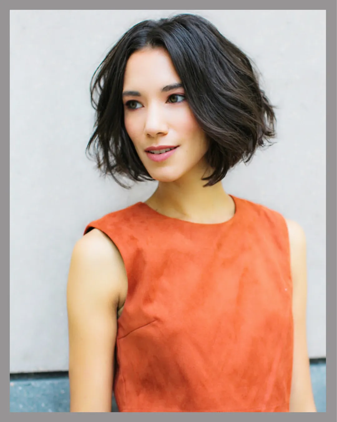 Soft black chin-length bob with side part