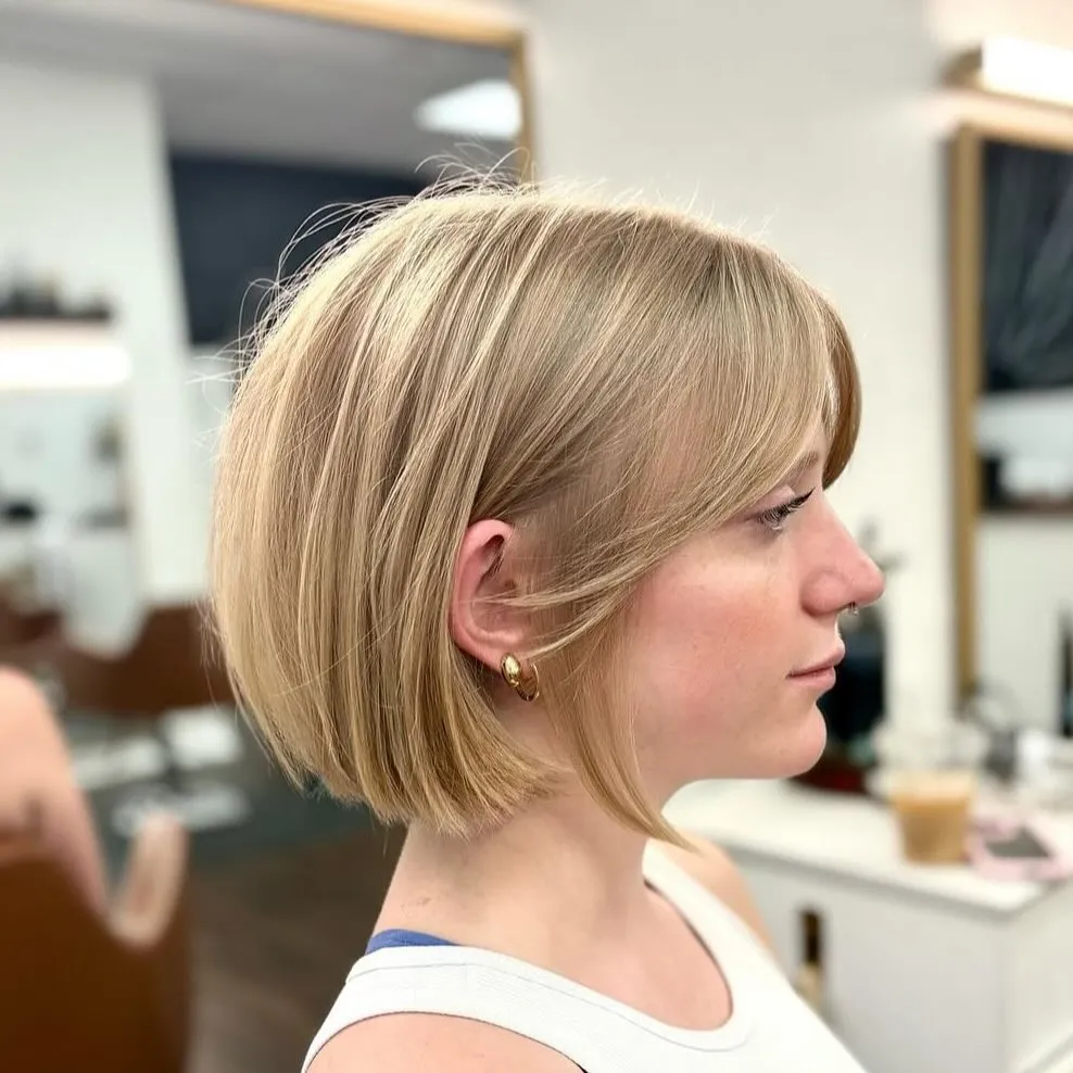 Rounded blonde bob with soft face framing