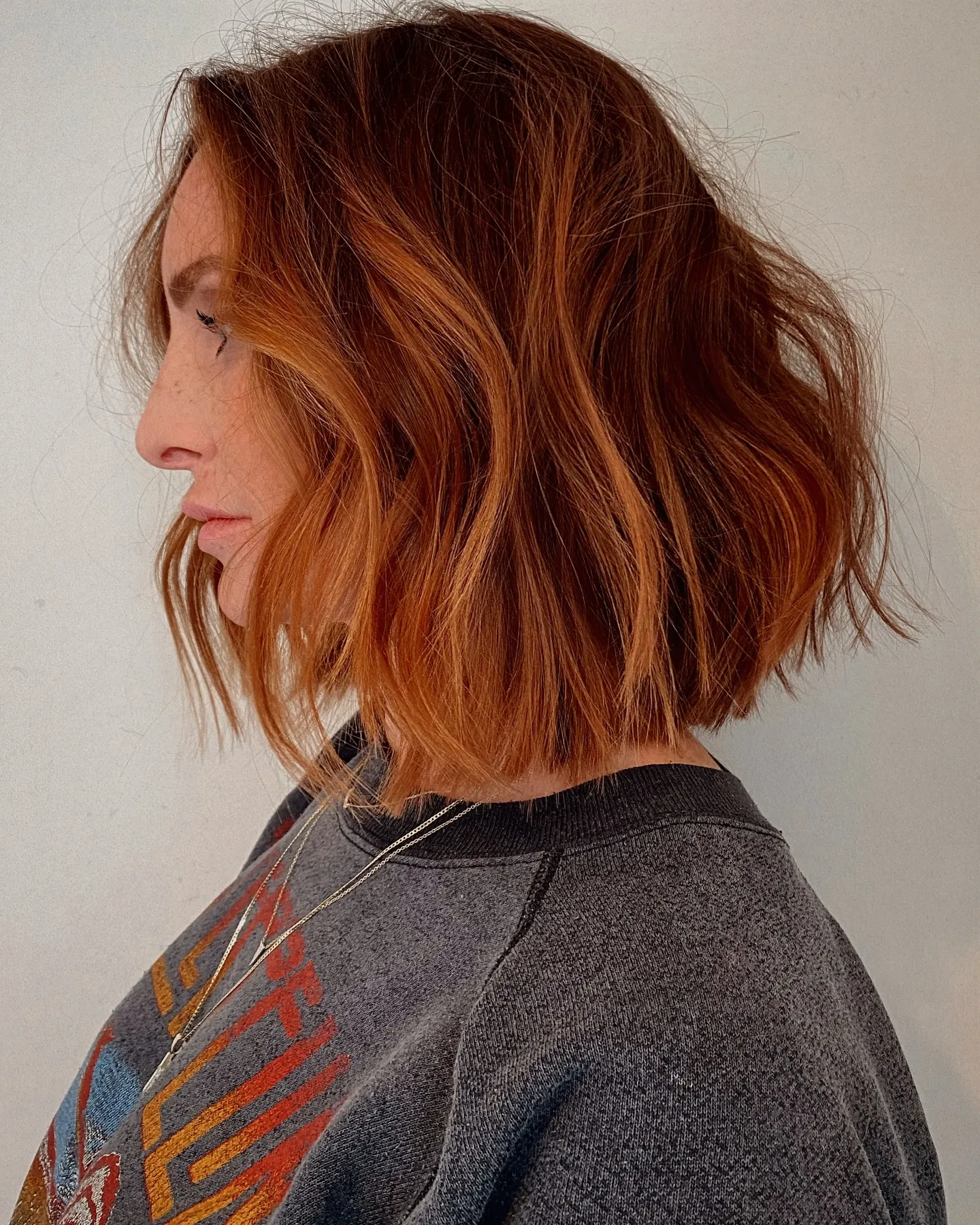 Textured copper bob with side part