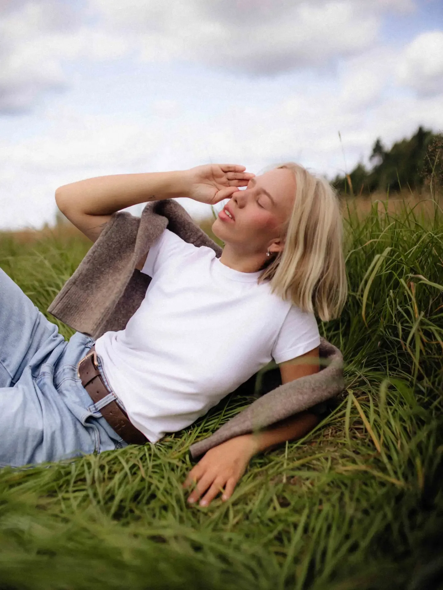 Straight pale blonde bob with center part