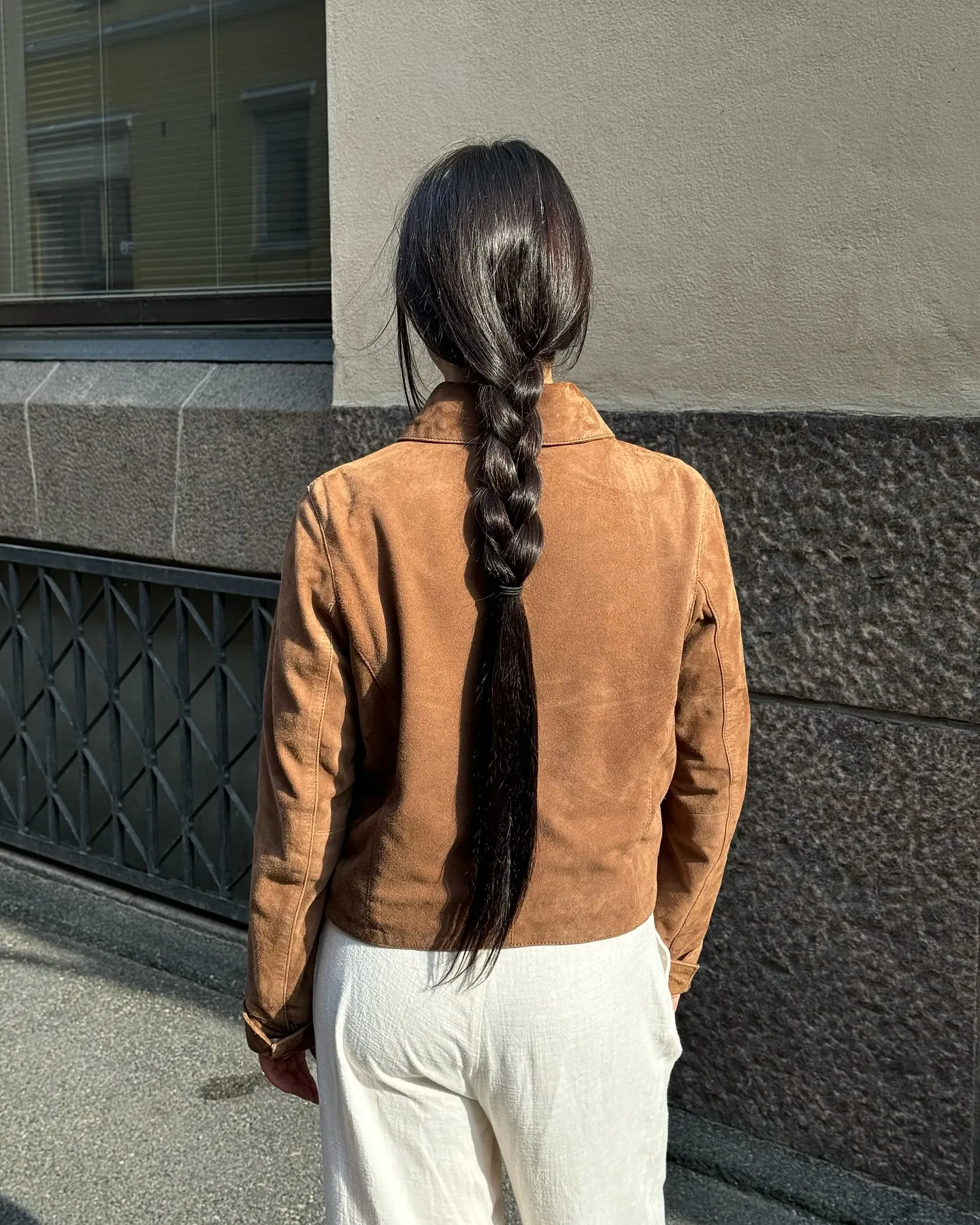 Low twisted bun secured with small tortoiseshell clips