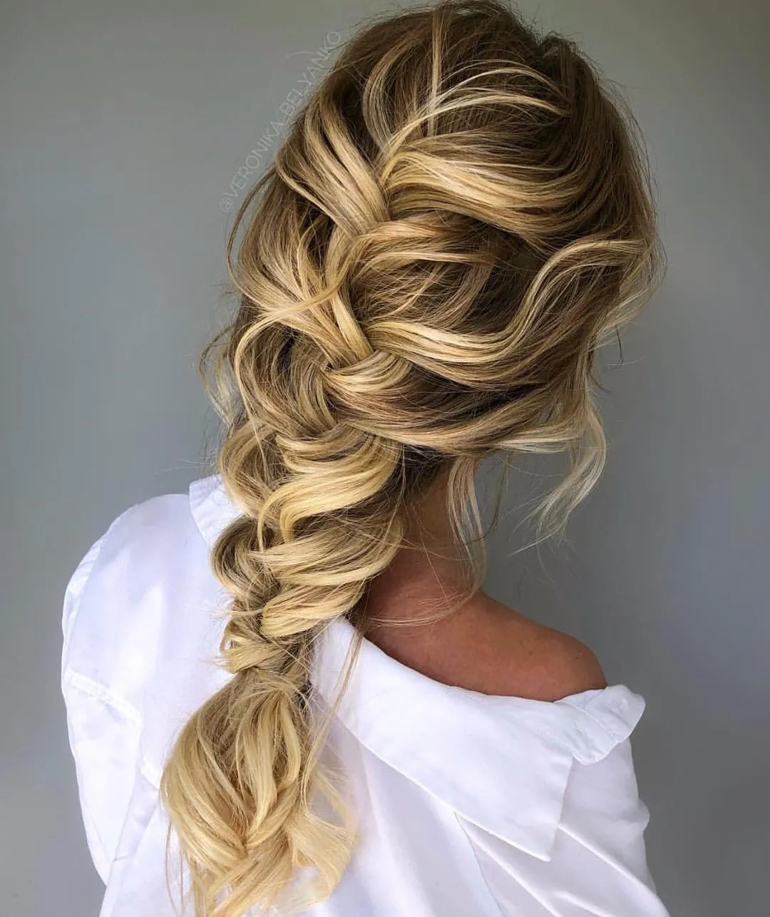 Relaxed French braid ending low at the nape