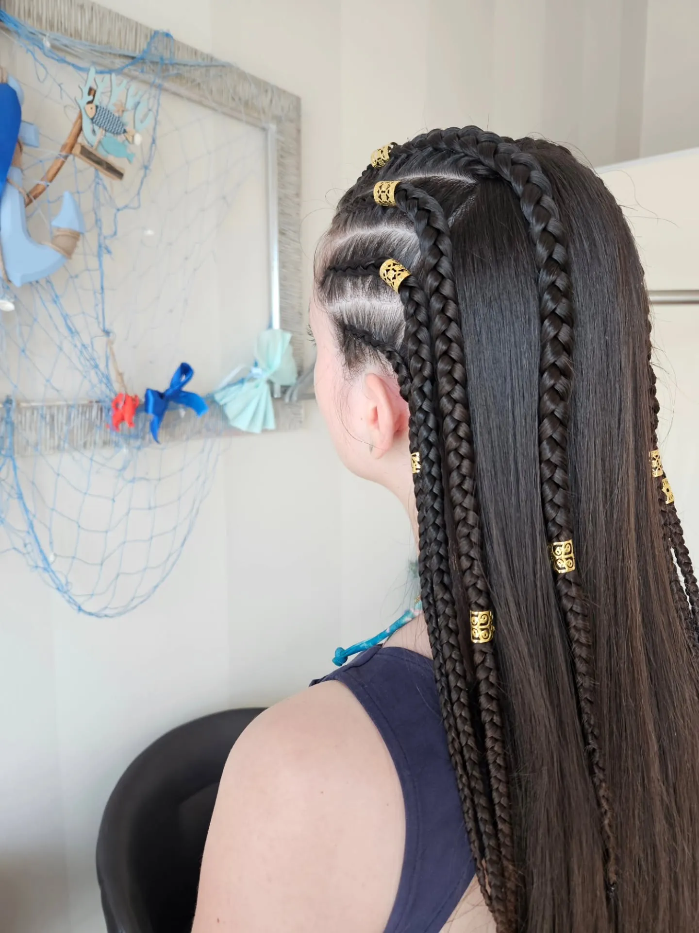 Dutch braid updo with low rolled bun details