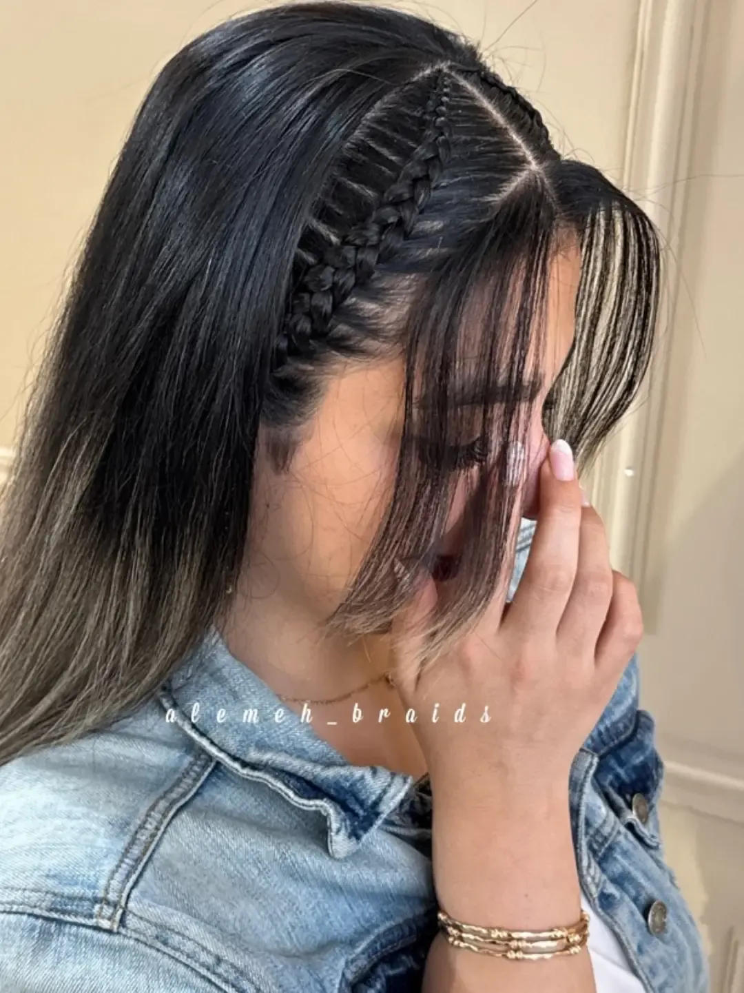 Two tight side accent braids with straight loose hair