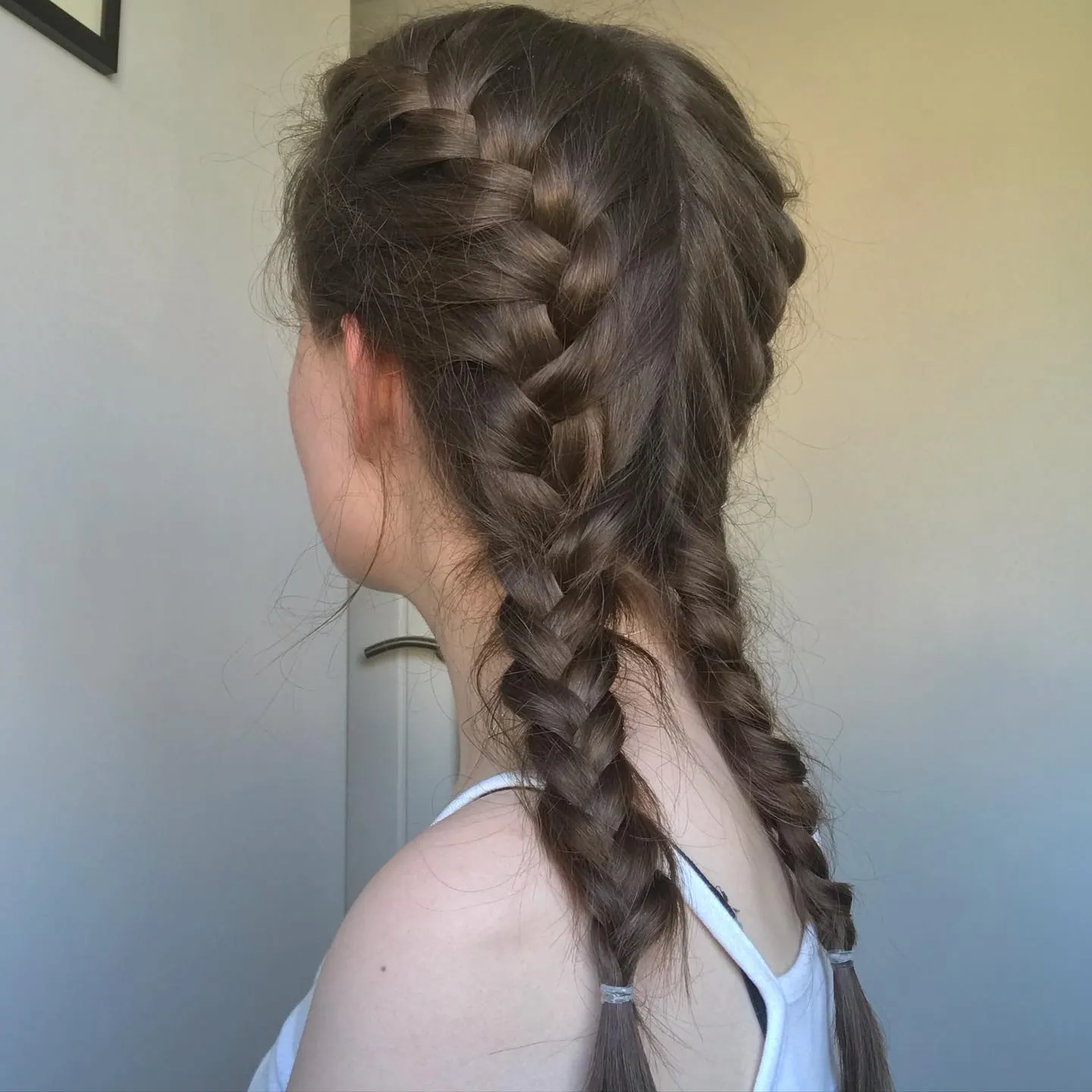 High top knot wrapped with a thick braid