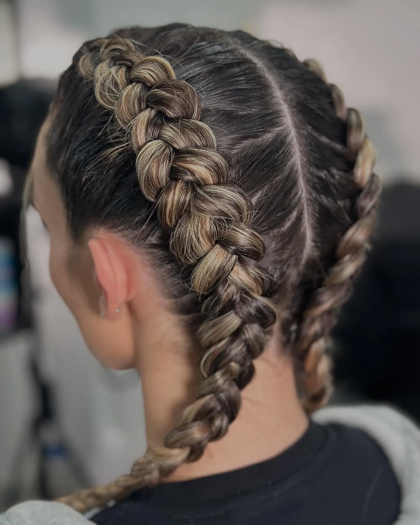 Loose half-up braid secured with a patterned scrunchie