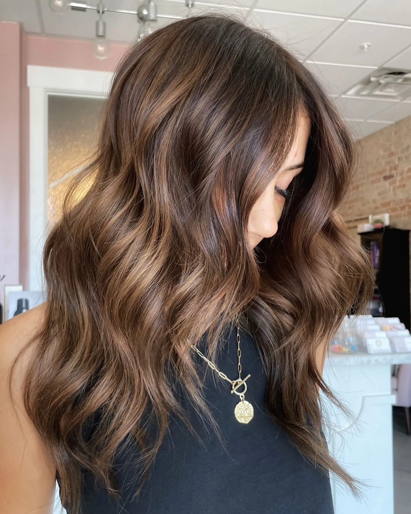 Long rich brown with soft waves and lighter dimension