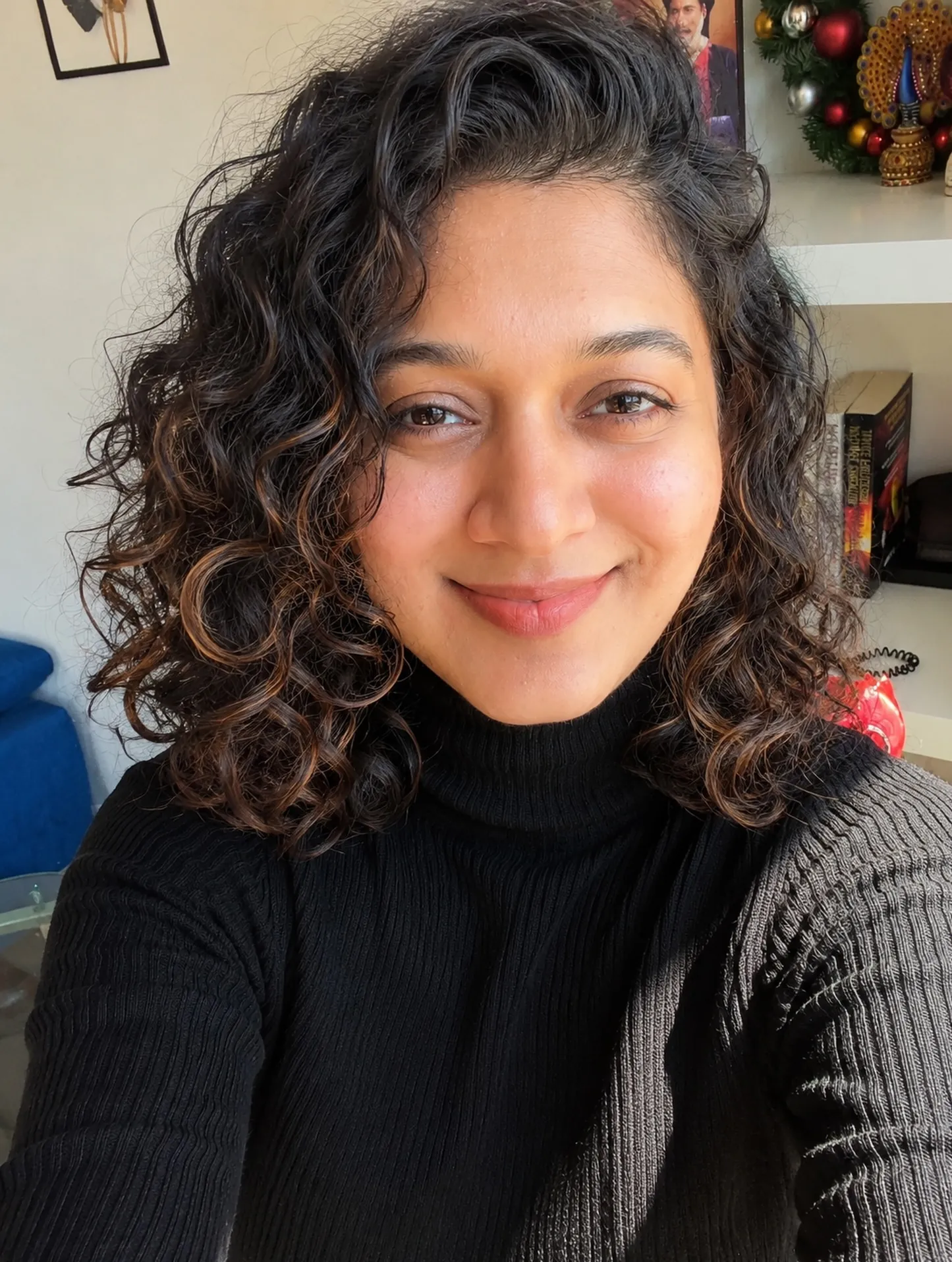 Shoulder-length curls with a deep side part
