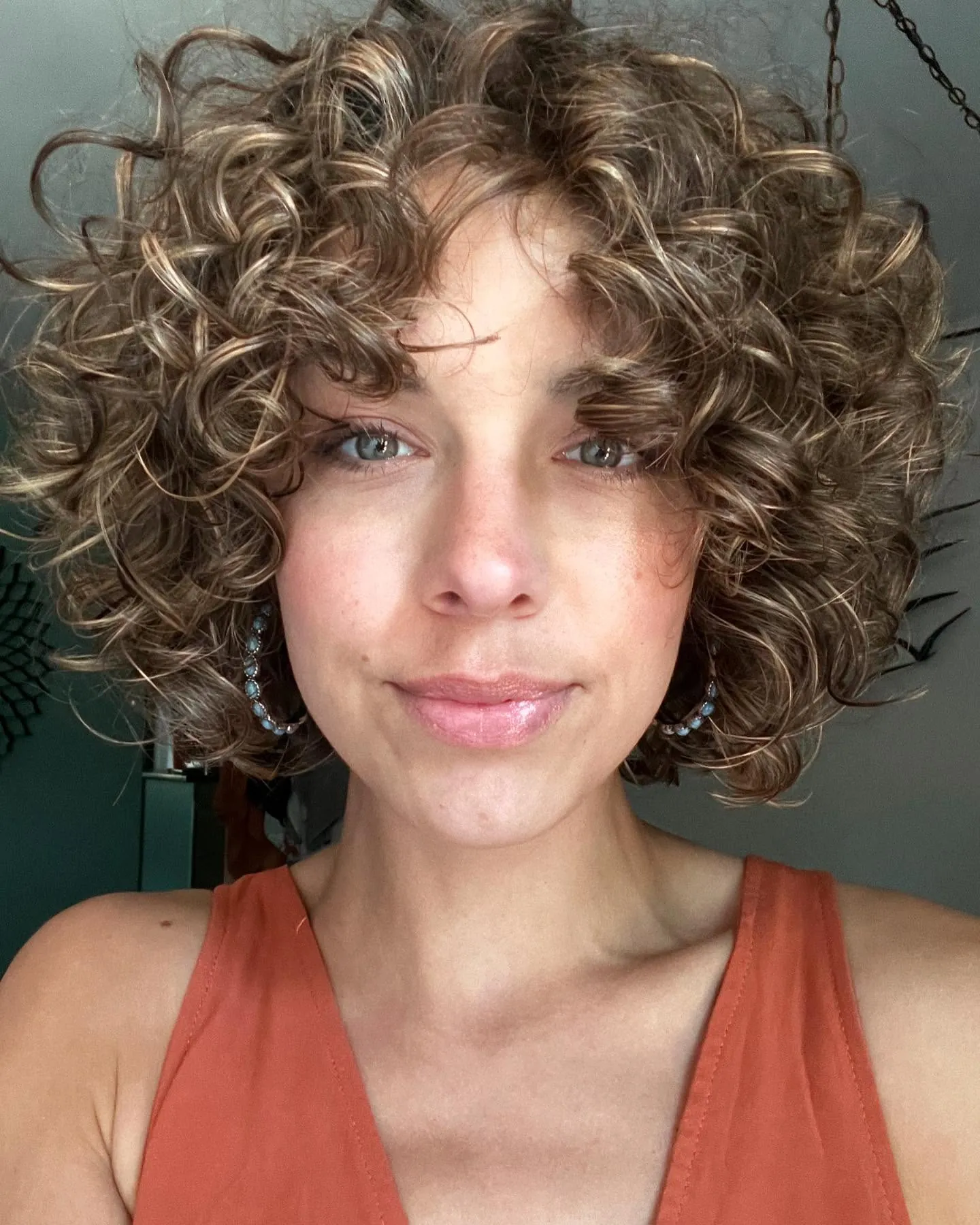 Rounded curly bob with a full curly fringe