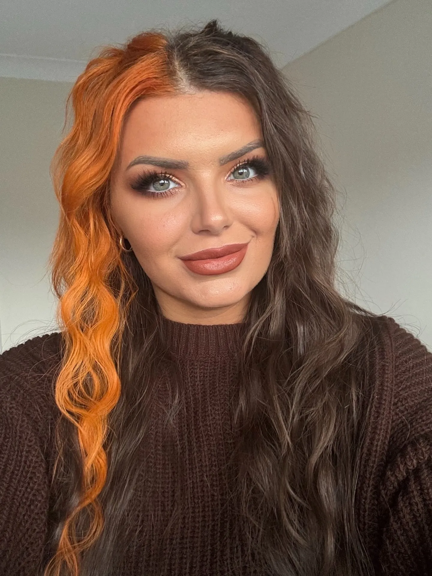 Long split-colour hair with vivid orange and dark wavy sections