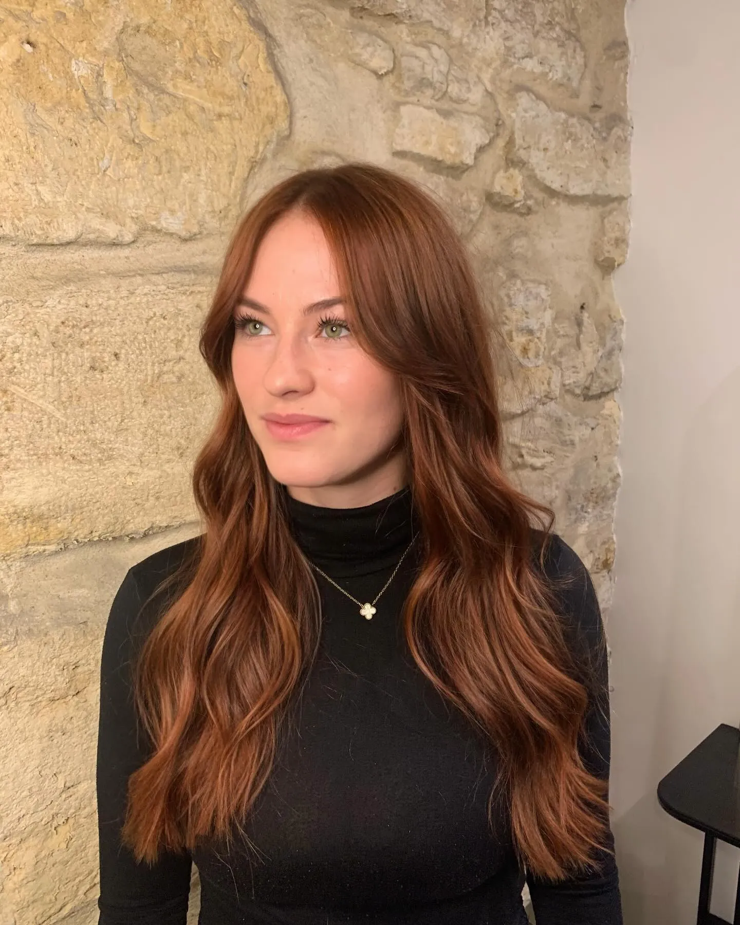 Long auburn waves with soft curtain bangs
