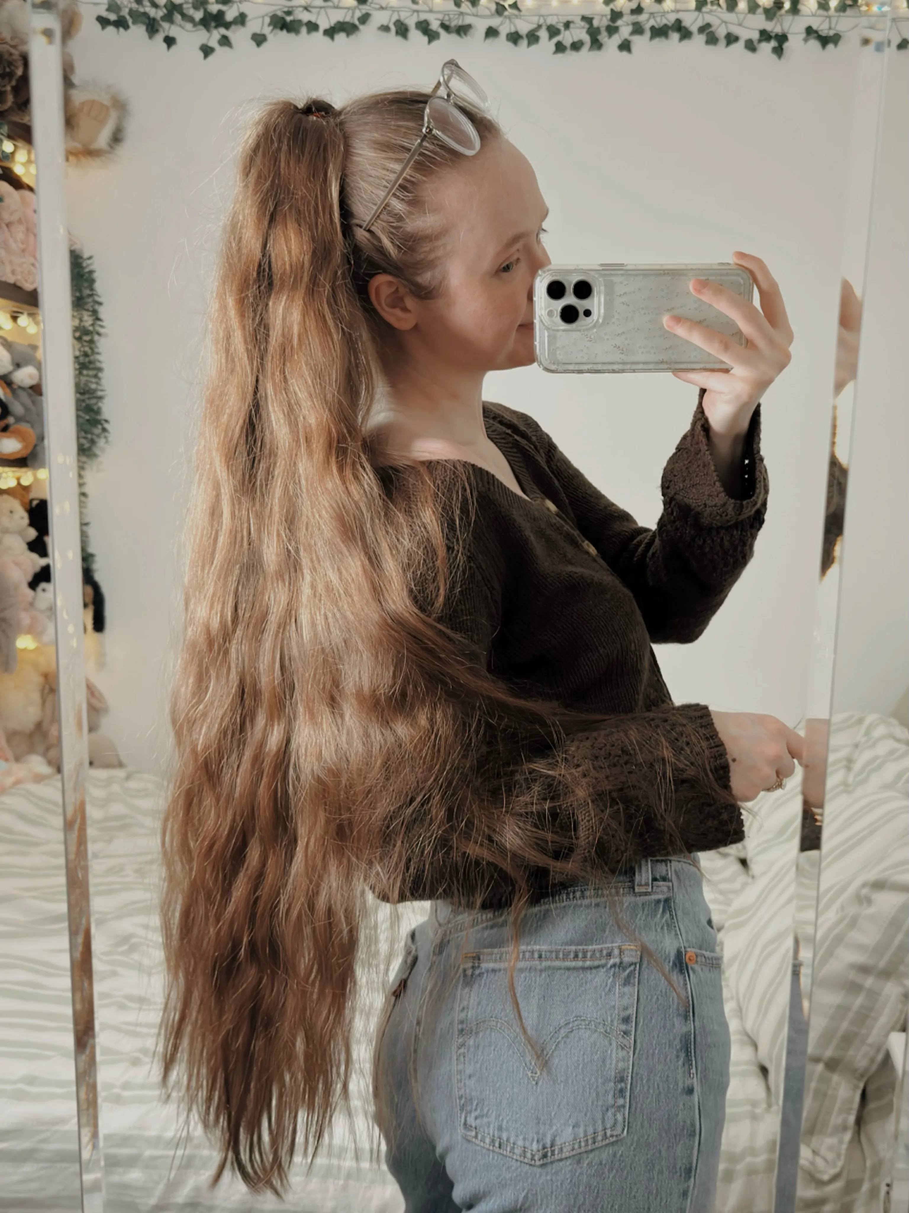 Very long wavy hair styled in a high ponytail