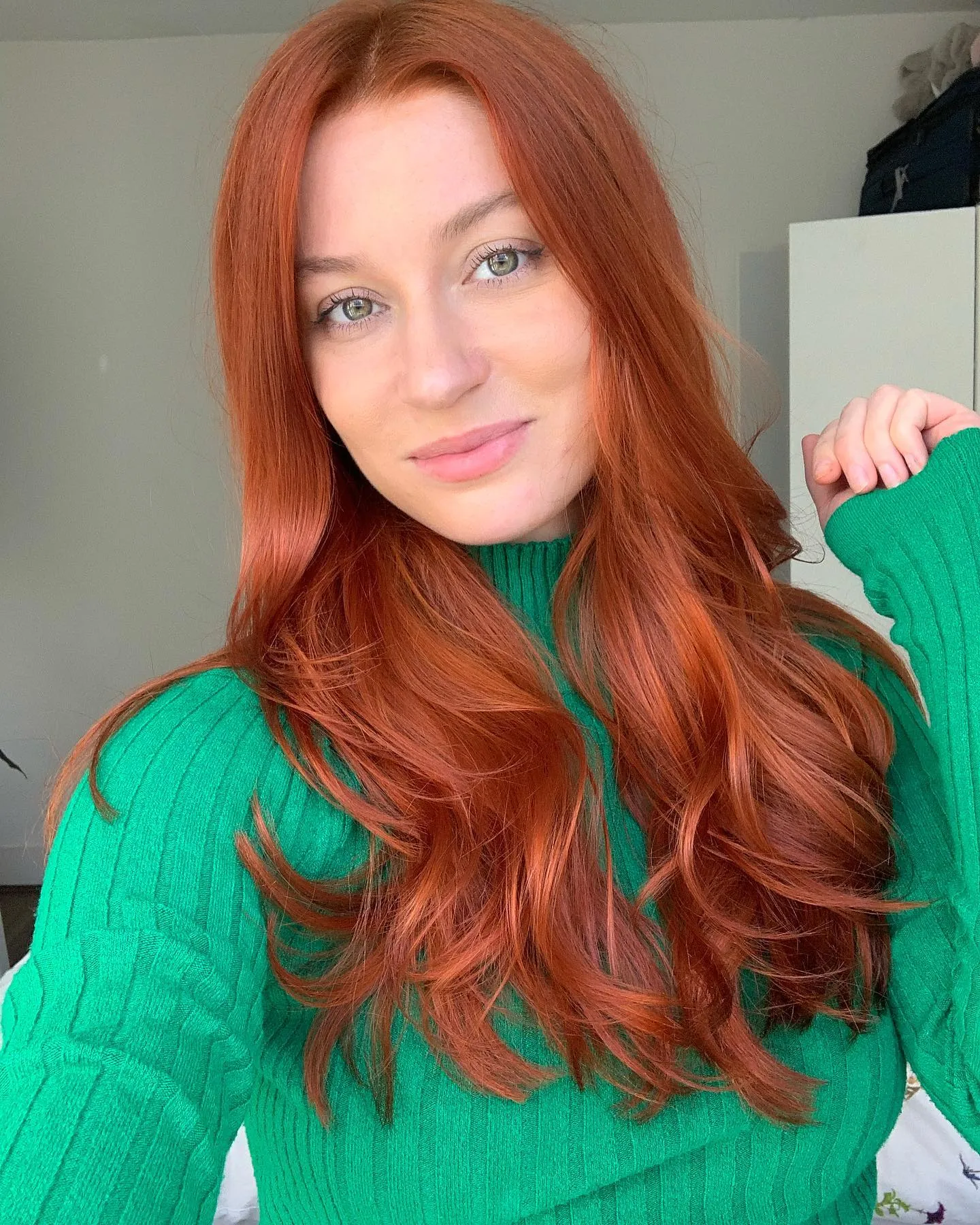 Long copper hair with bouncy face-framing layers and curled ends