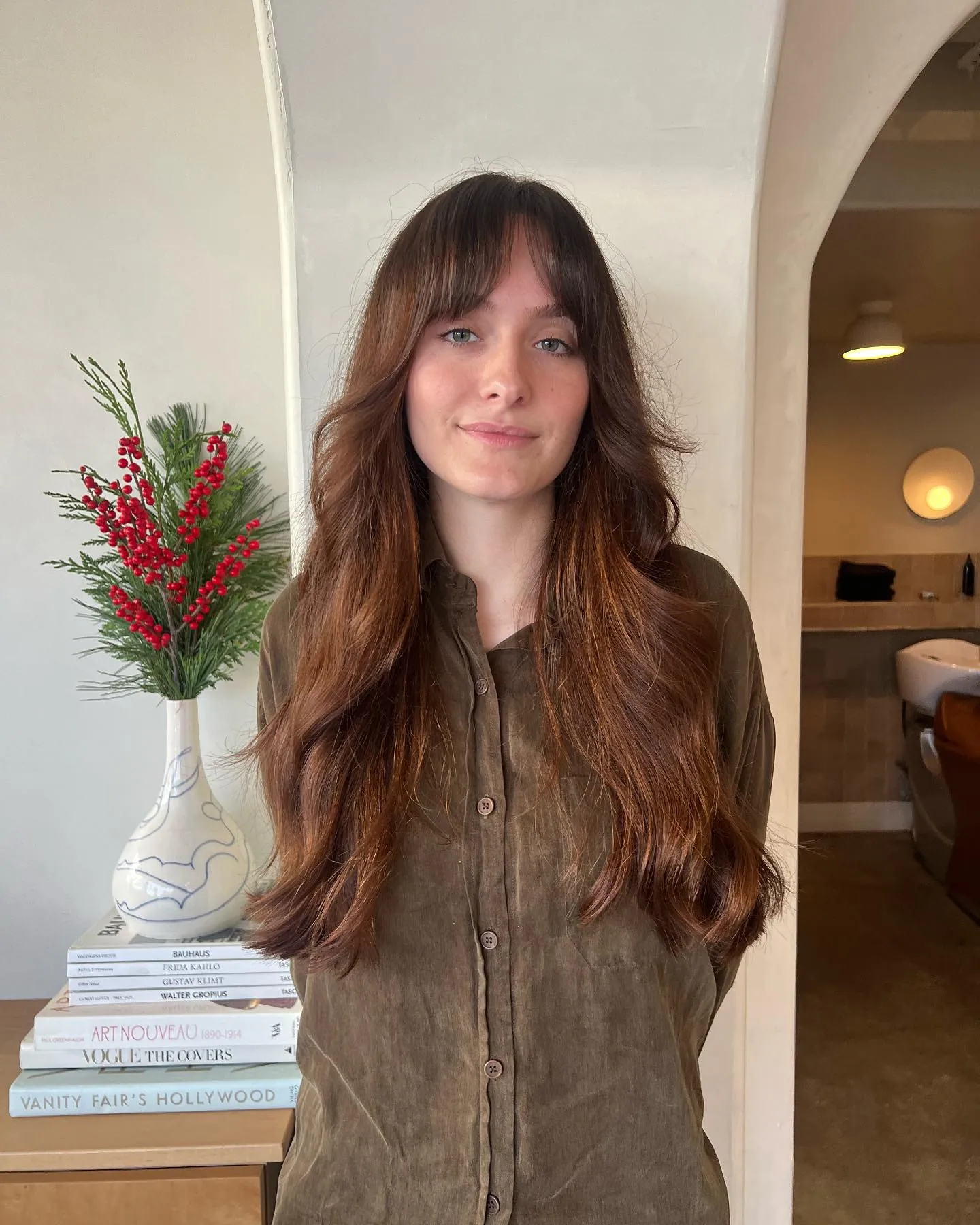 Long dark auburn waves with wispy curtain fringe