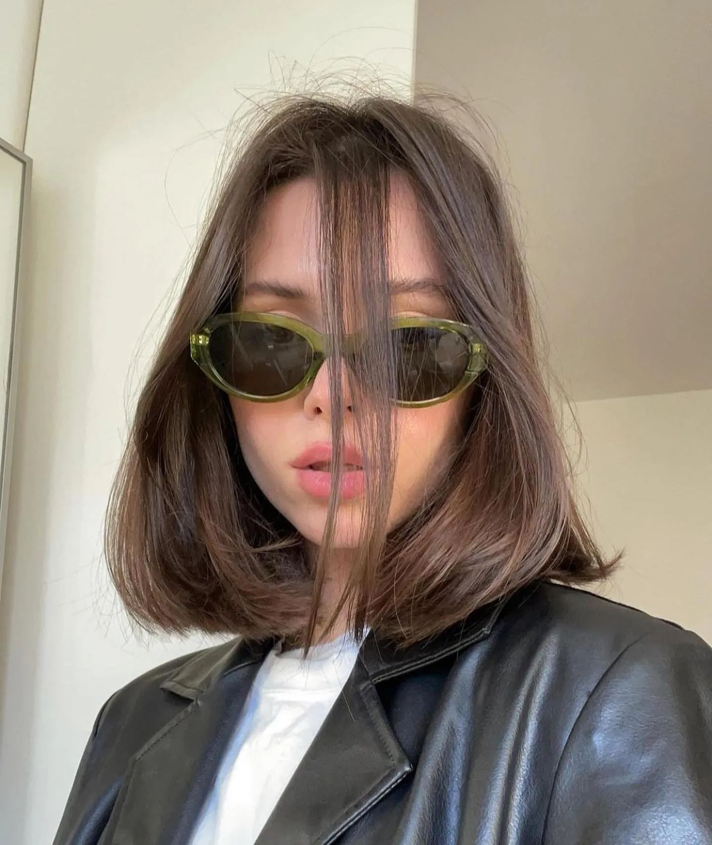 Rounded lob with long wispy fringe and flipped ends