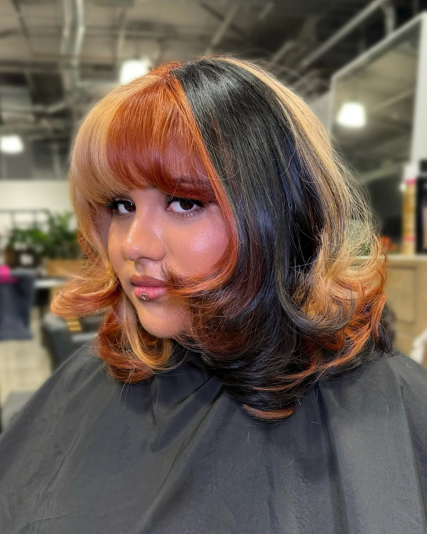 Split-color bob with flipped ends and full fringe