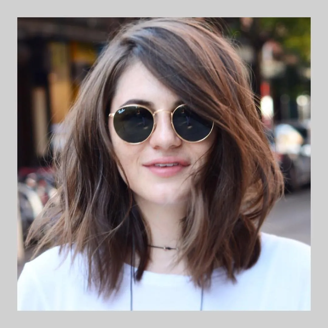 Tousled wavy lob with long side fringe