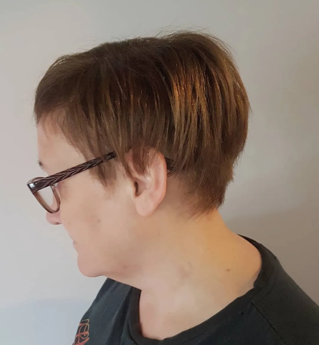Short warm brown pixie with subtle highlights