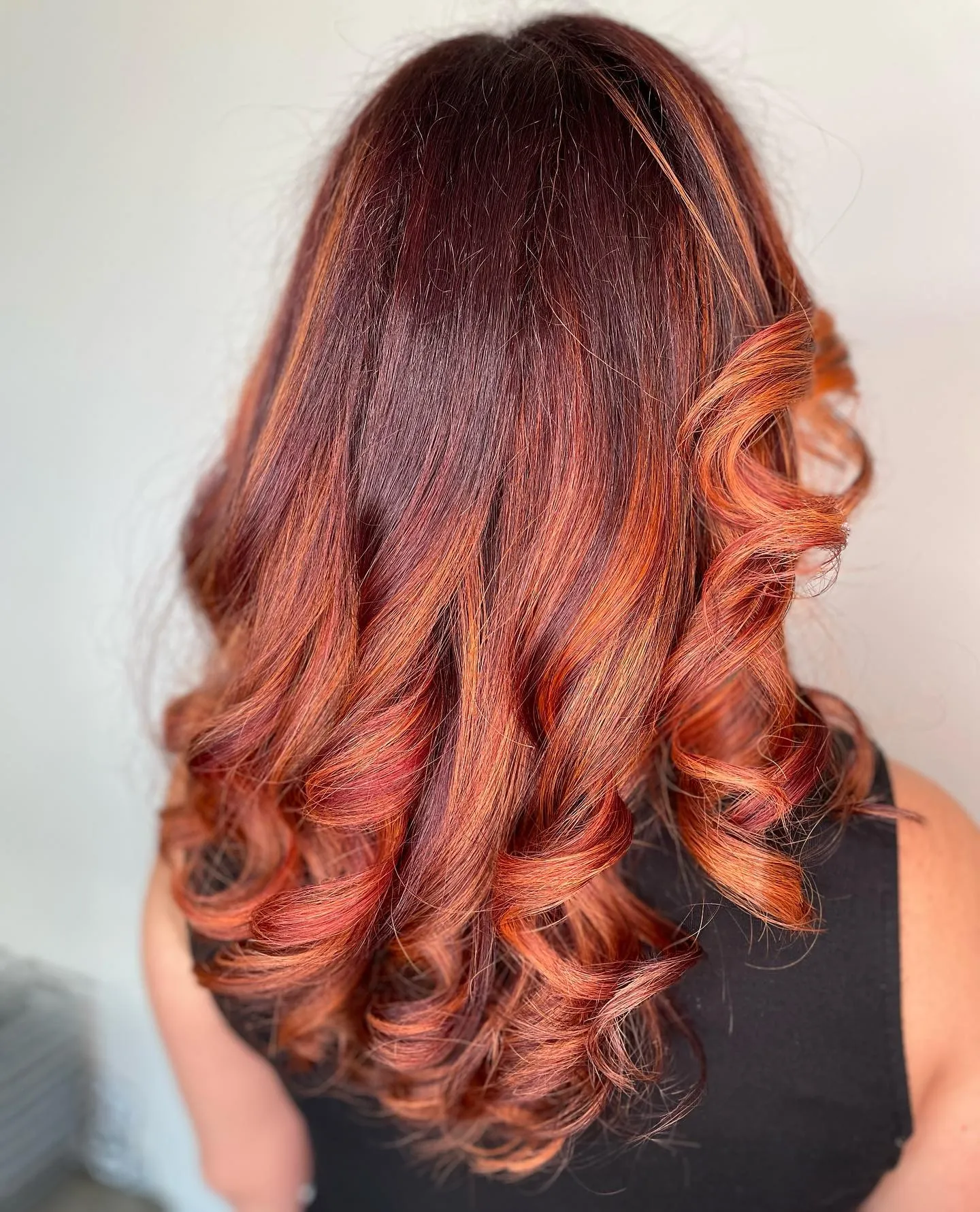 Deep red with copper ends curly