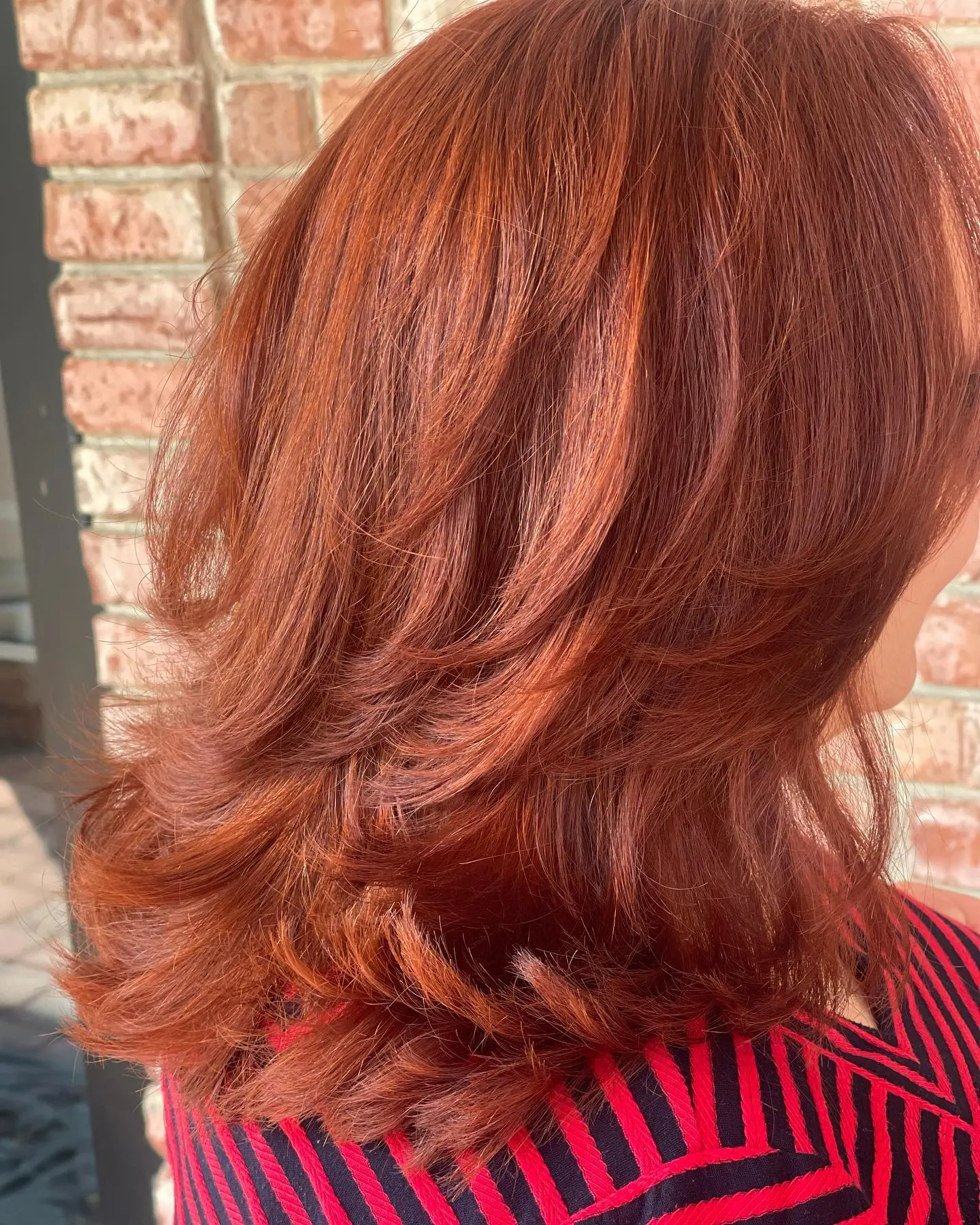 Warm copper-red layered medium length