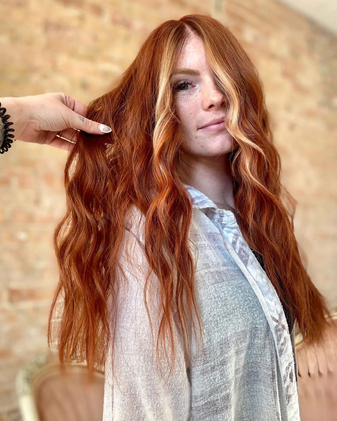 Long copper-red with blonde face framing