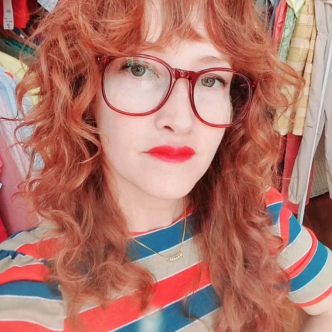 Curly copper-red with bangs