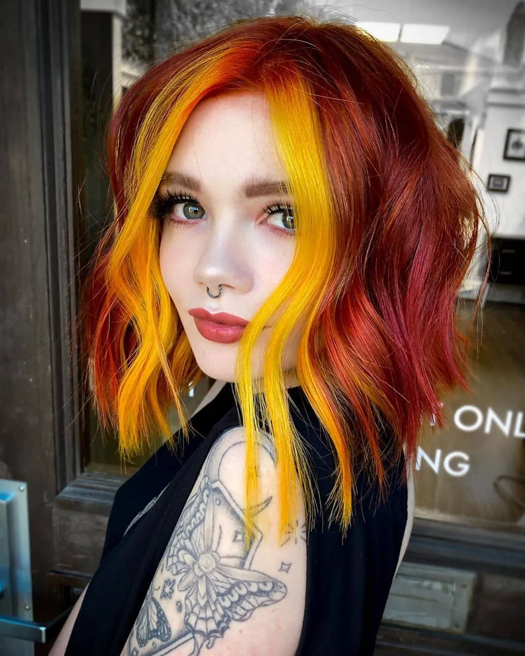 Short red bob with vivid yellow face-framing panels