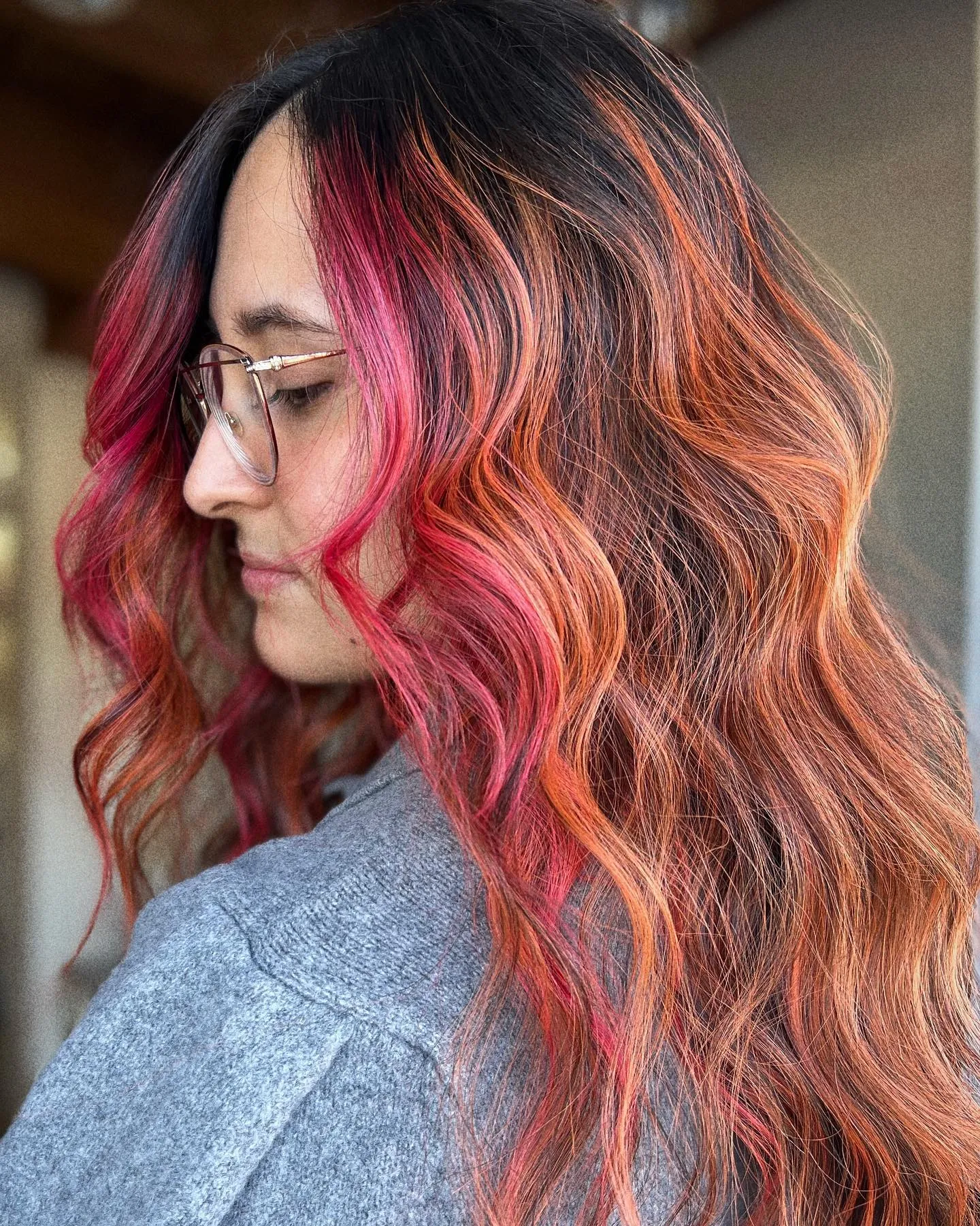 Long waves with vivid pink and orange face-framing ribbons