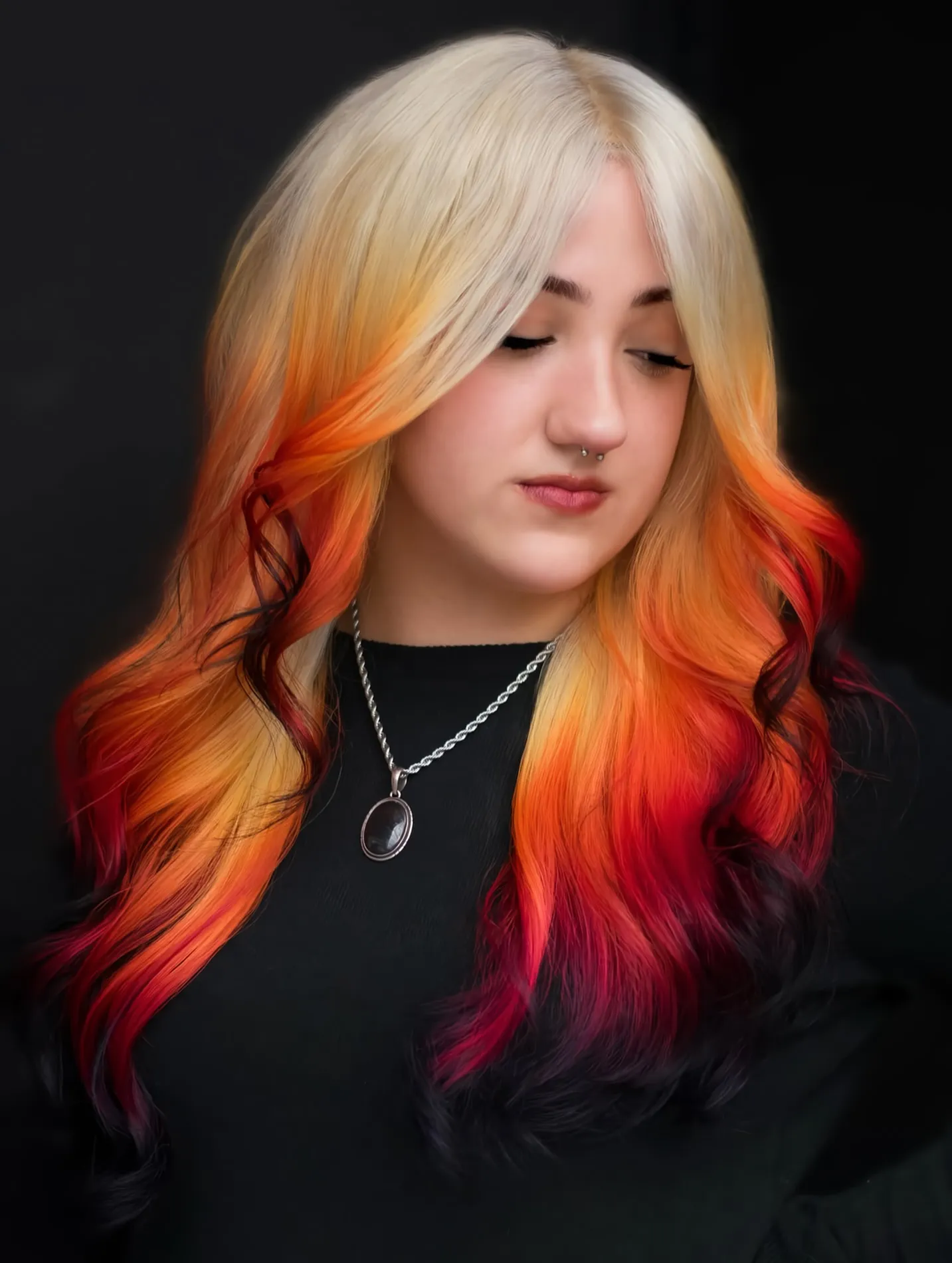 Long pale blonde waves fading into orange and red ends