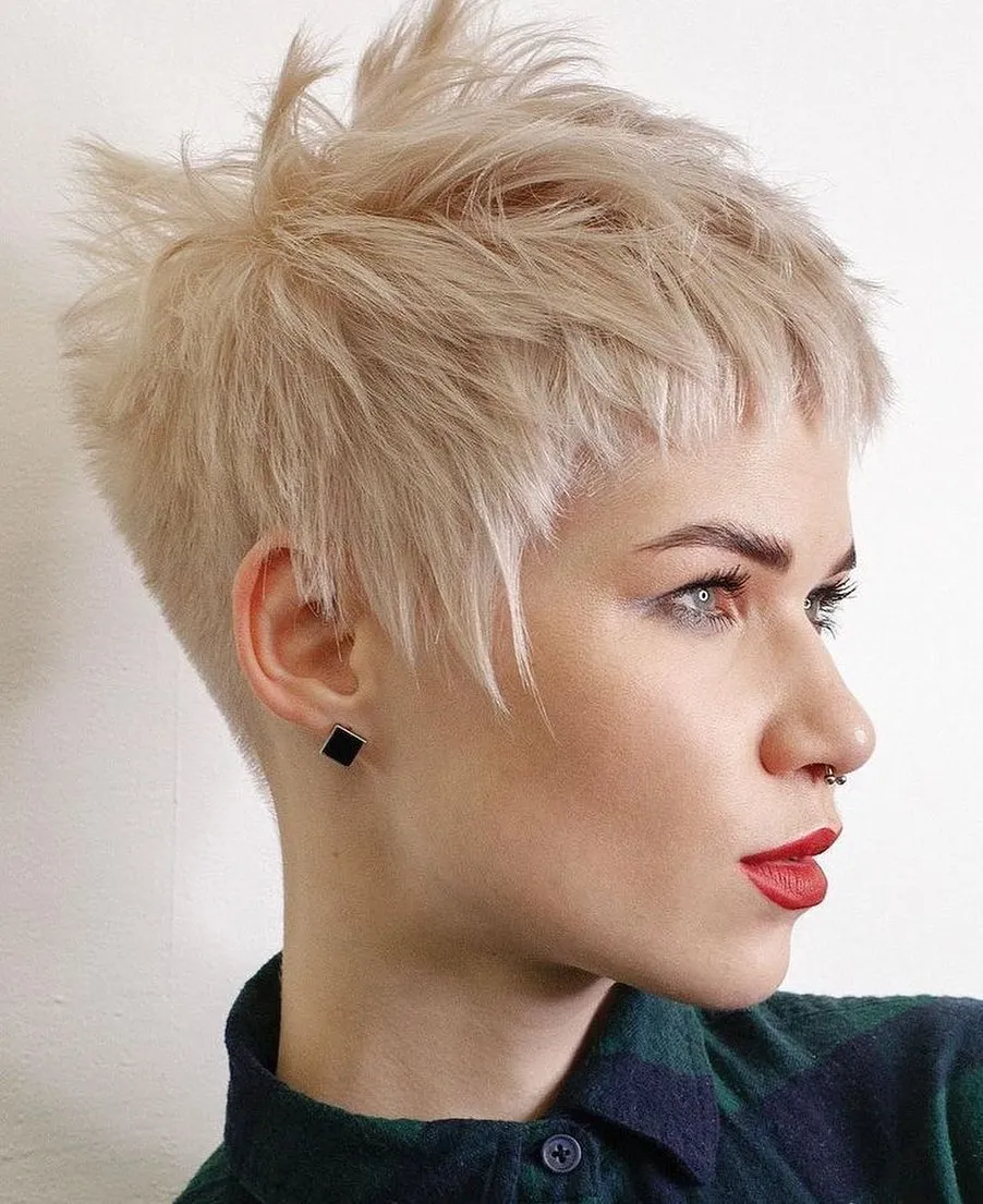Choppy platinum pixie with a lifted crown and short textured fringe