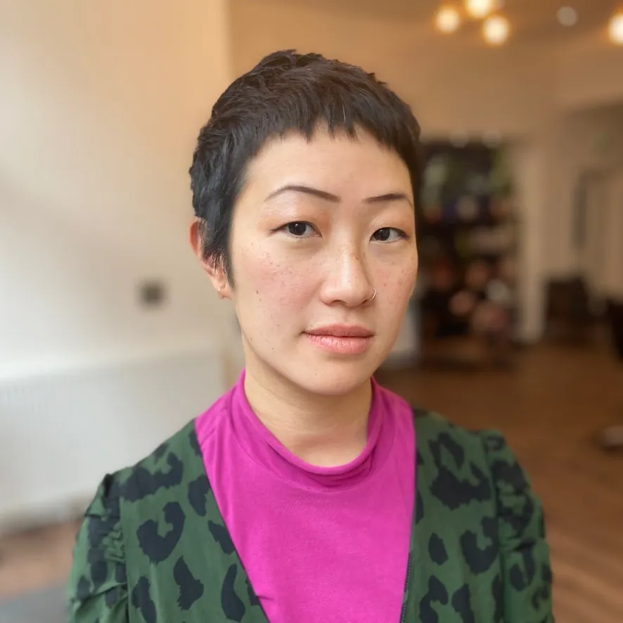 Close-cropped pixie with a short textured fringe and neat sides
