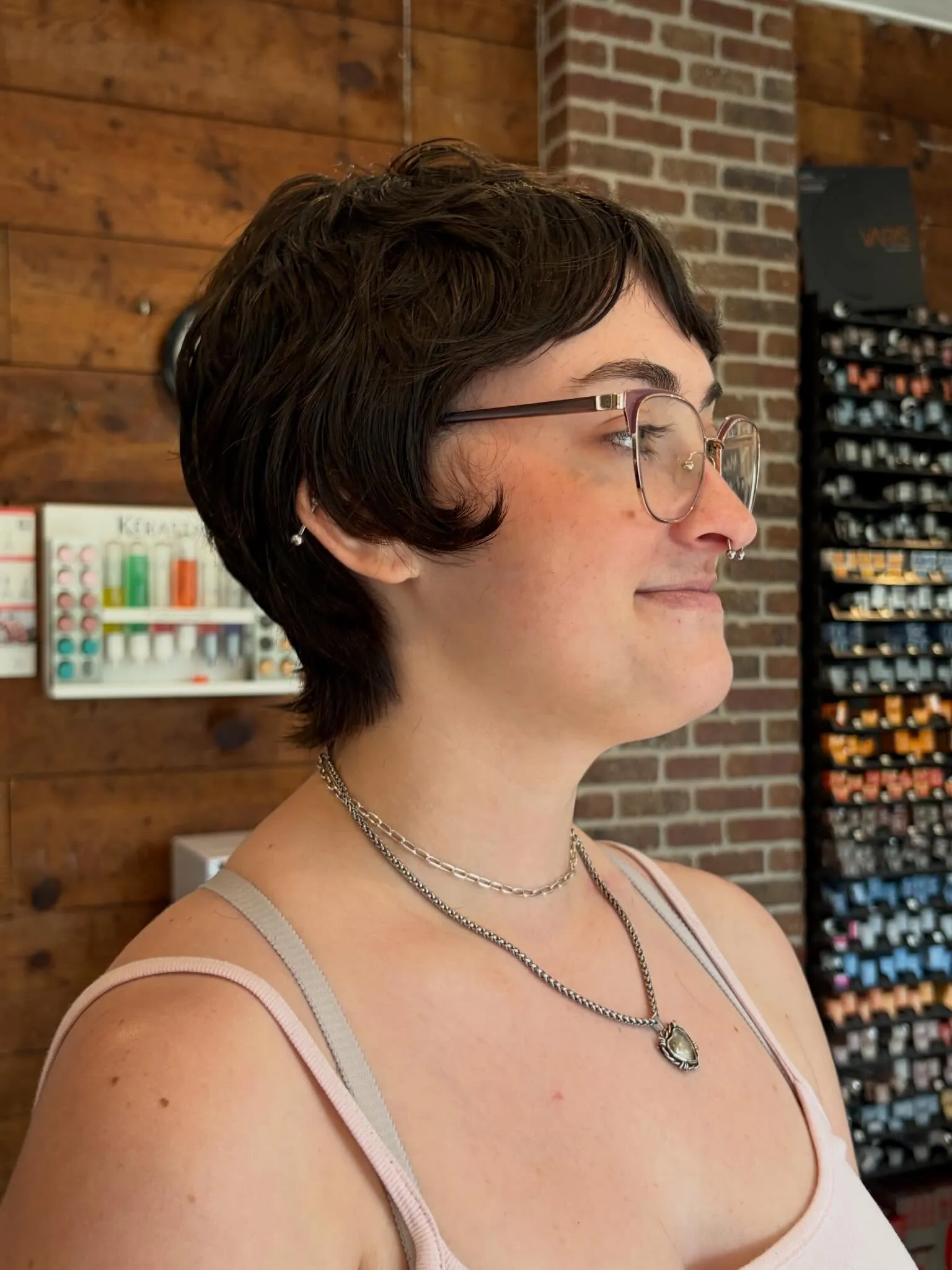 Rounded feathered pixie with a short fringe and curved side pieces