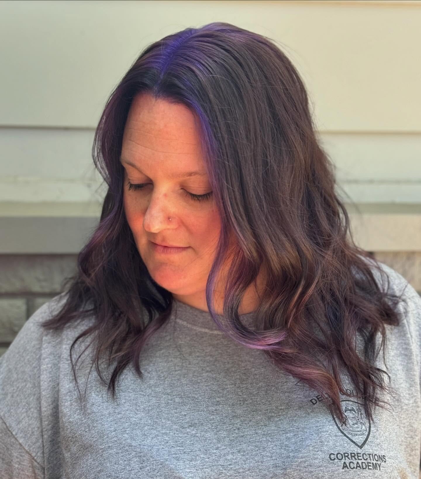 long wavy layered haircut with face-framing pieces