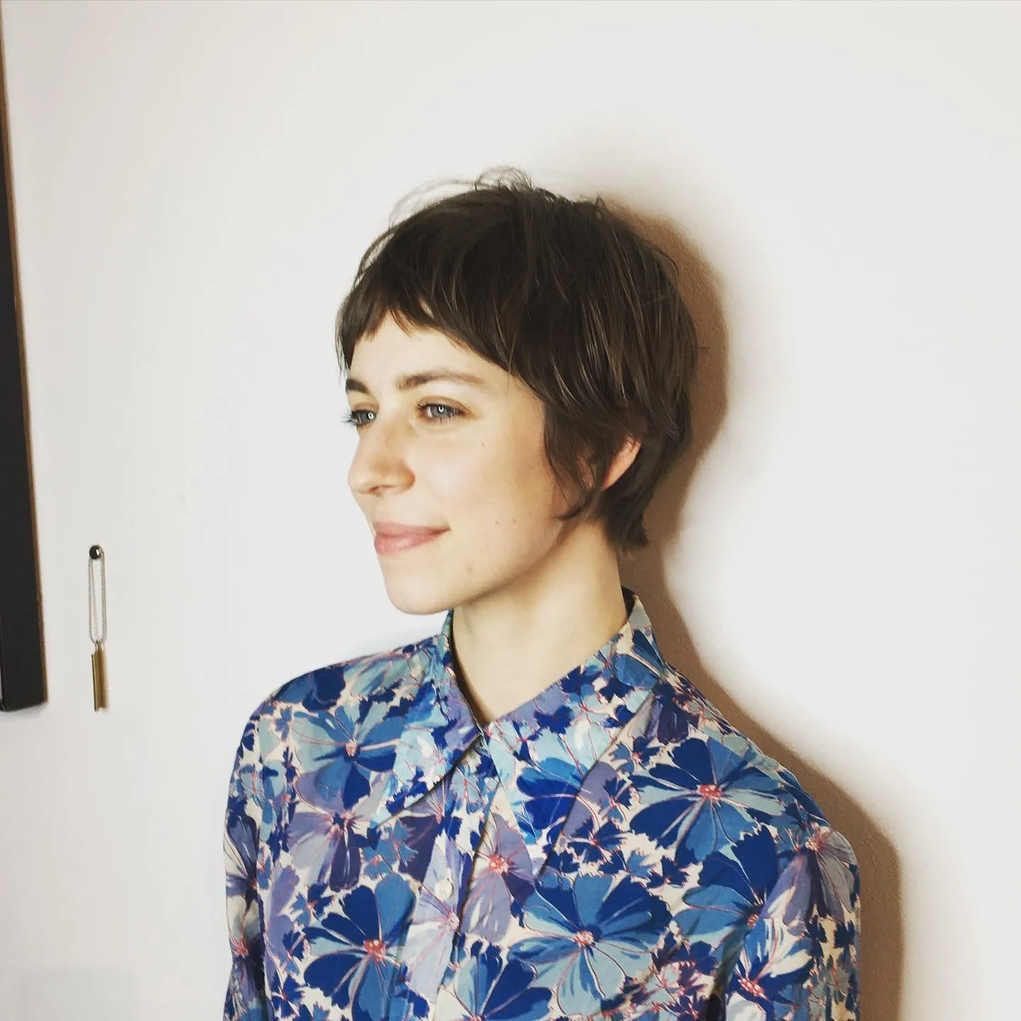 Rounded dark pixie cut with a wispy short fringe