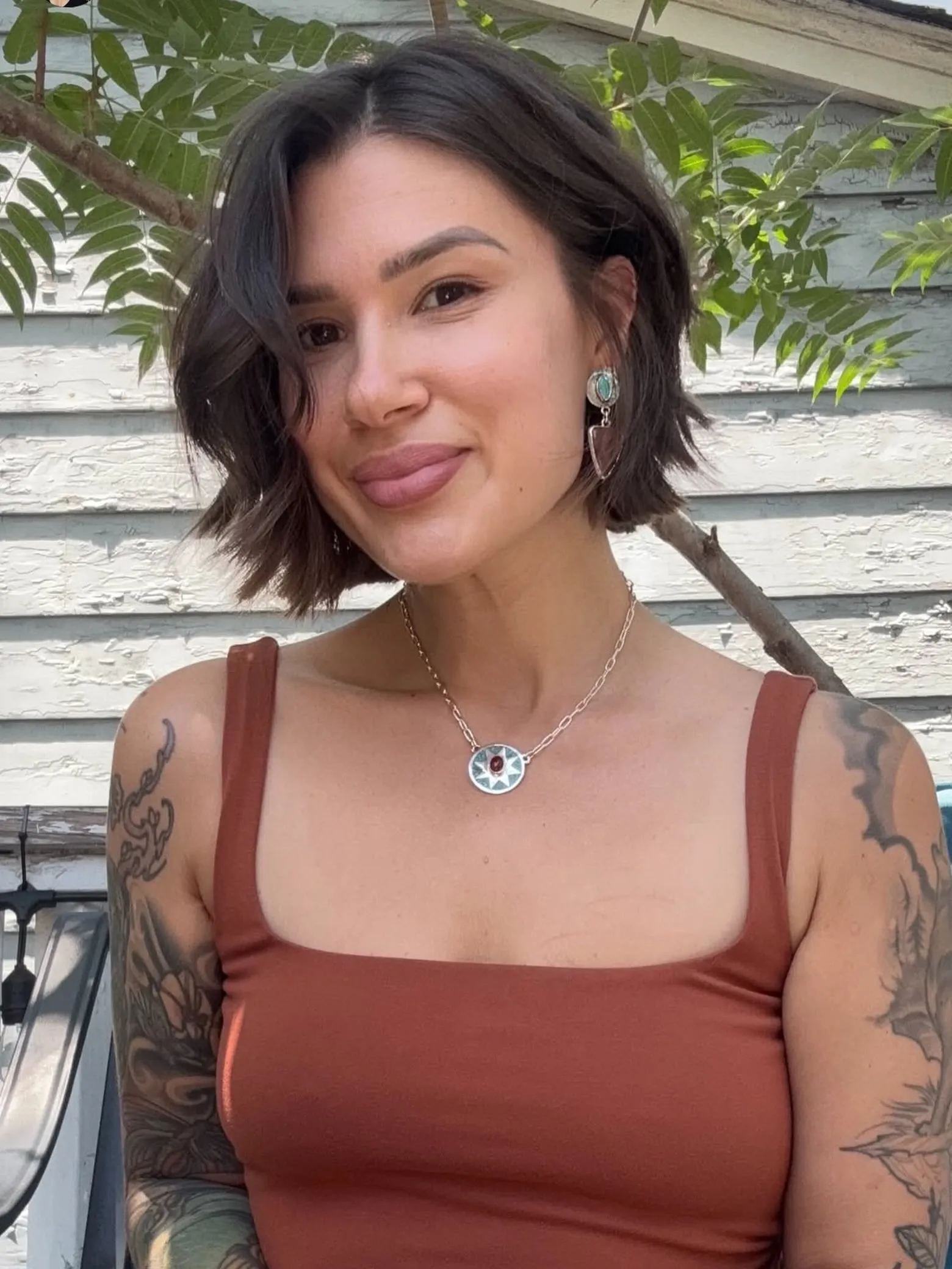 Asymmetrical dark jaw-length bob with a deep side sweep